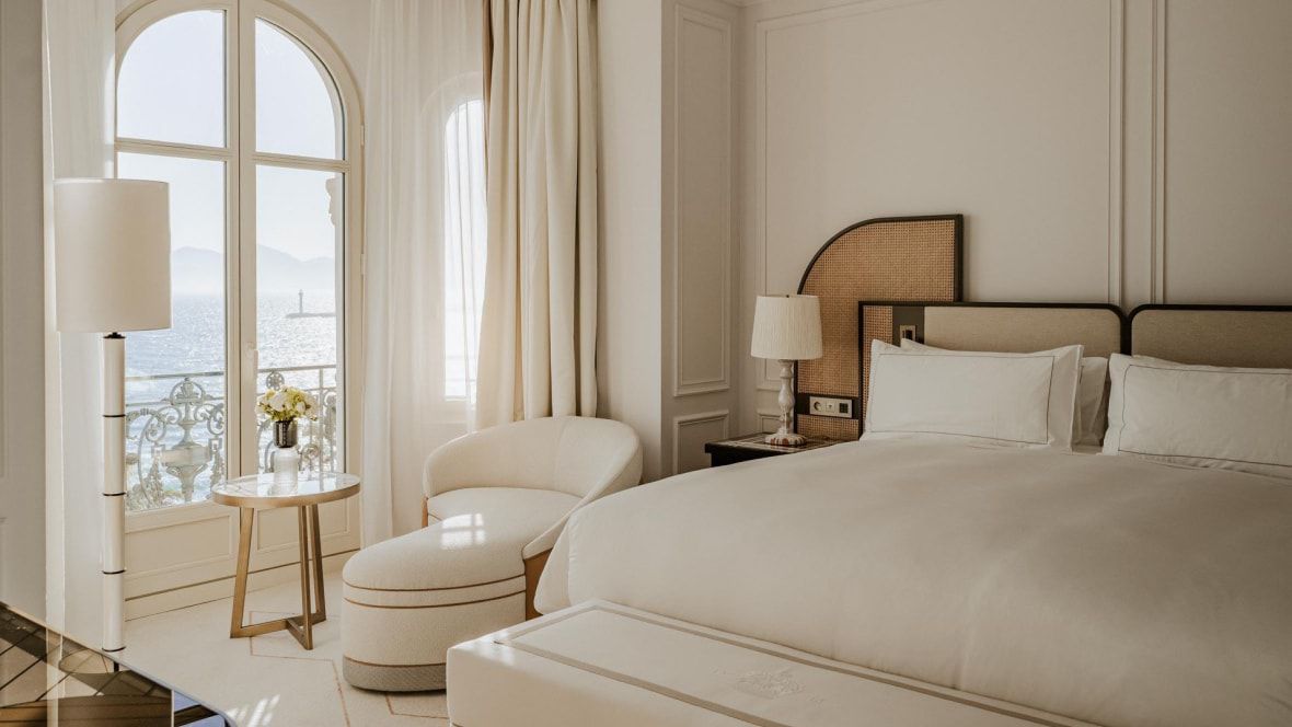 guestroom with decor in a palette of ivory throughout