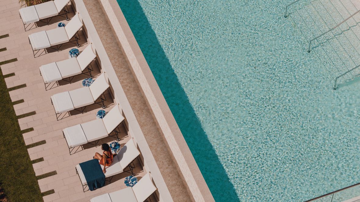 overhead view of swimming pool and chaise lounges