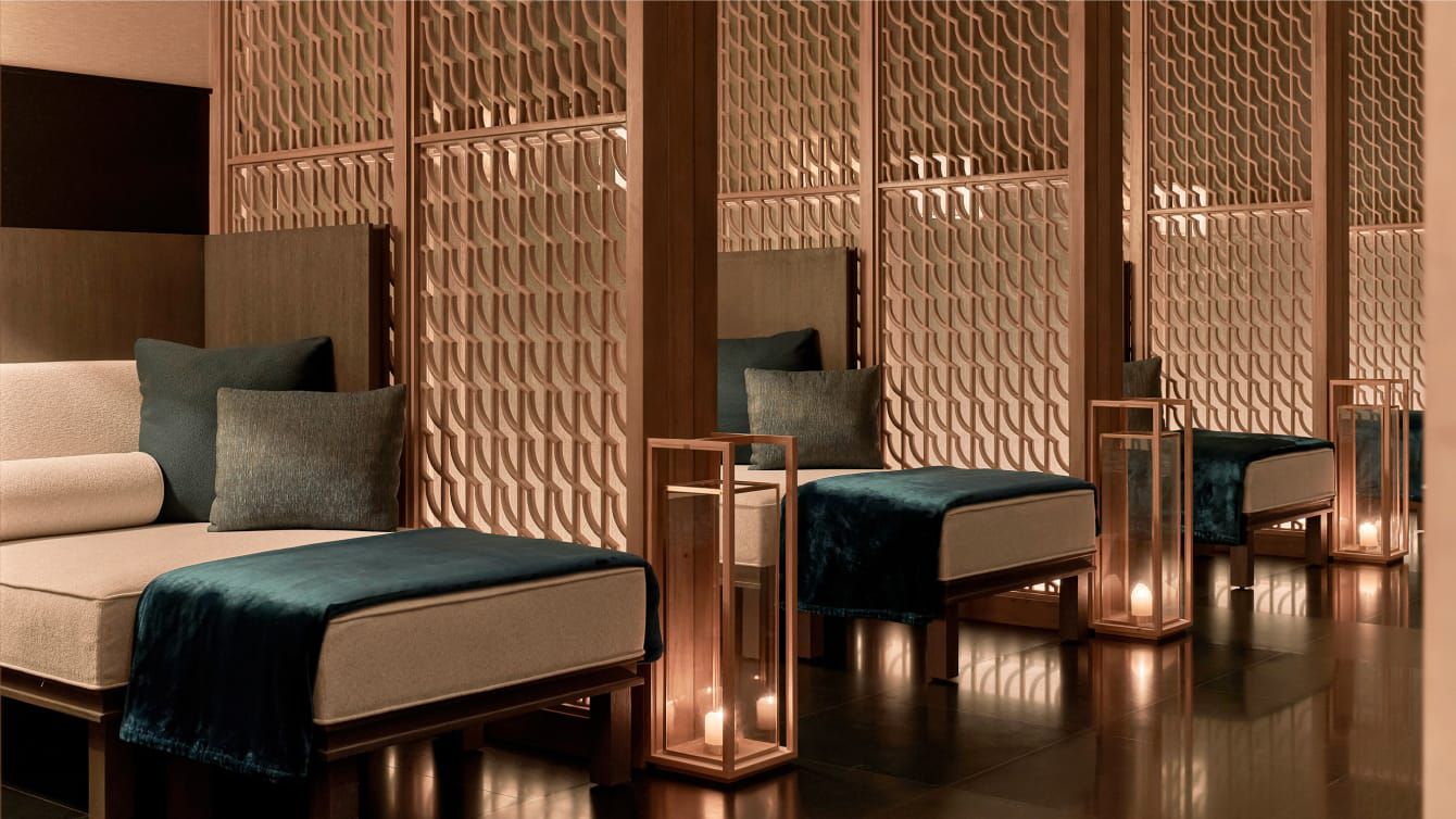 Soaring guest room doors open to a Mediterranean sunset