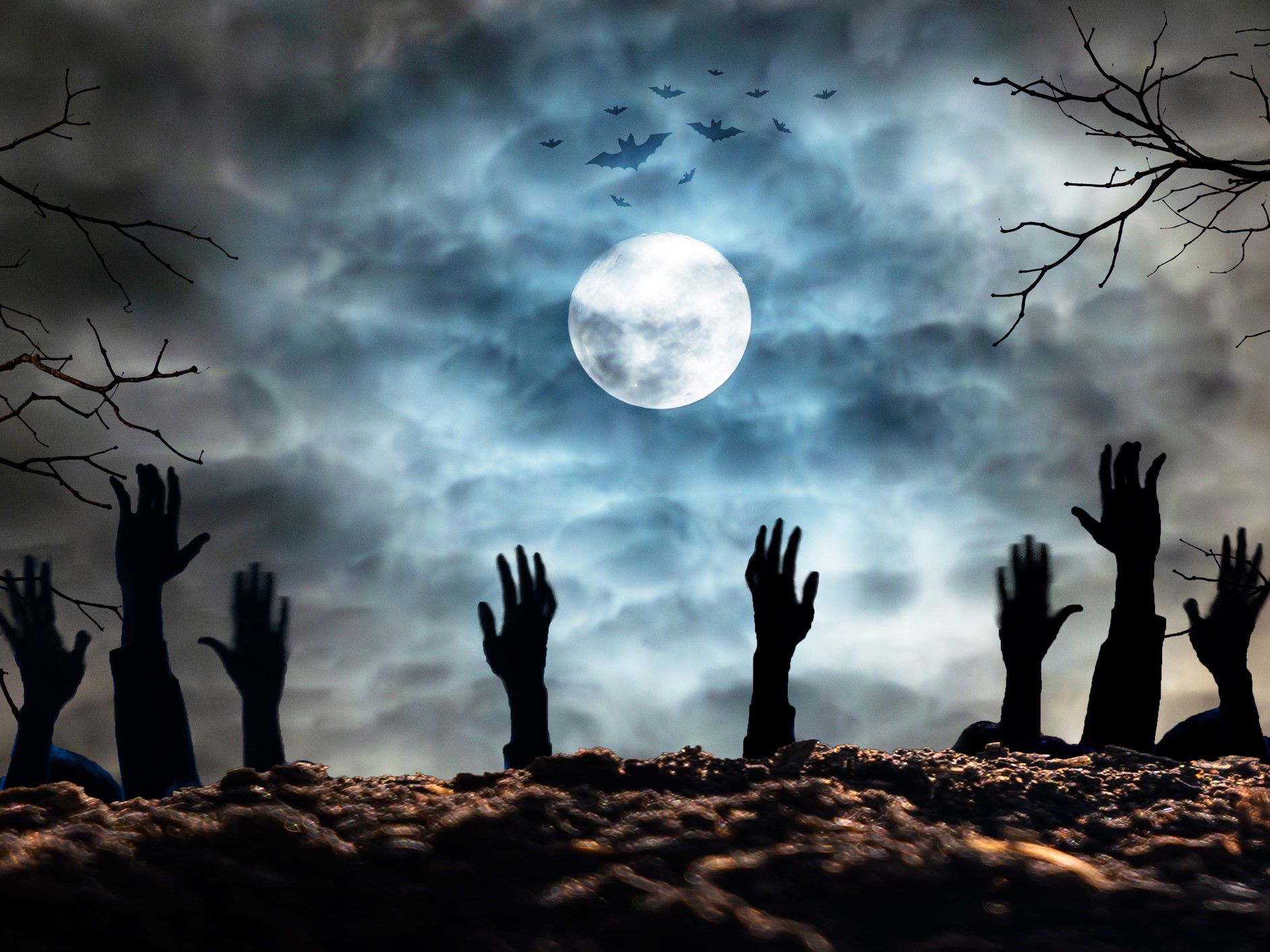 Hands coming up from graves