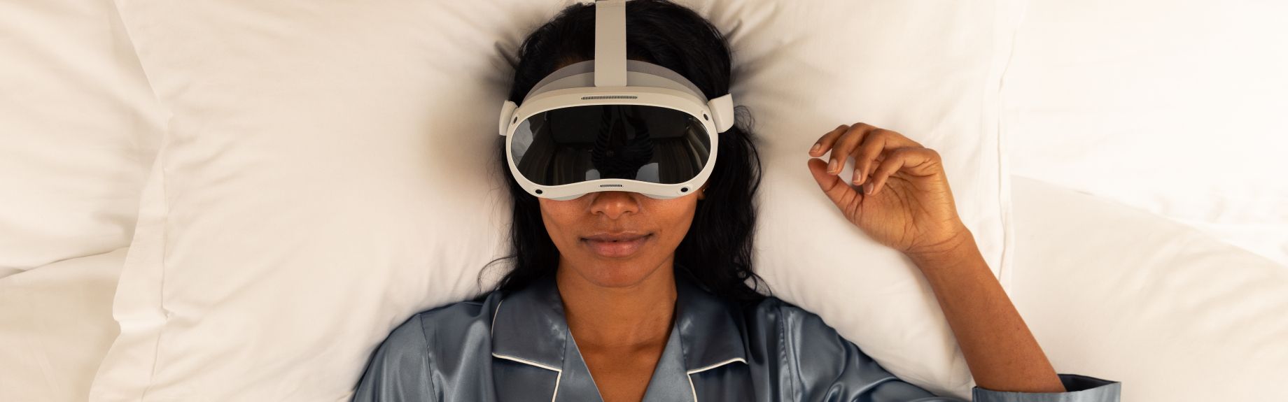 Hotel guest sleeping with VR headset goggles