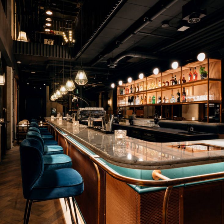 Bar area with plush chairs in a row