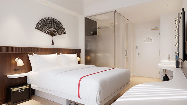 Hotel lobby with curved furniture and greenery