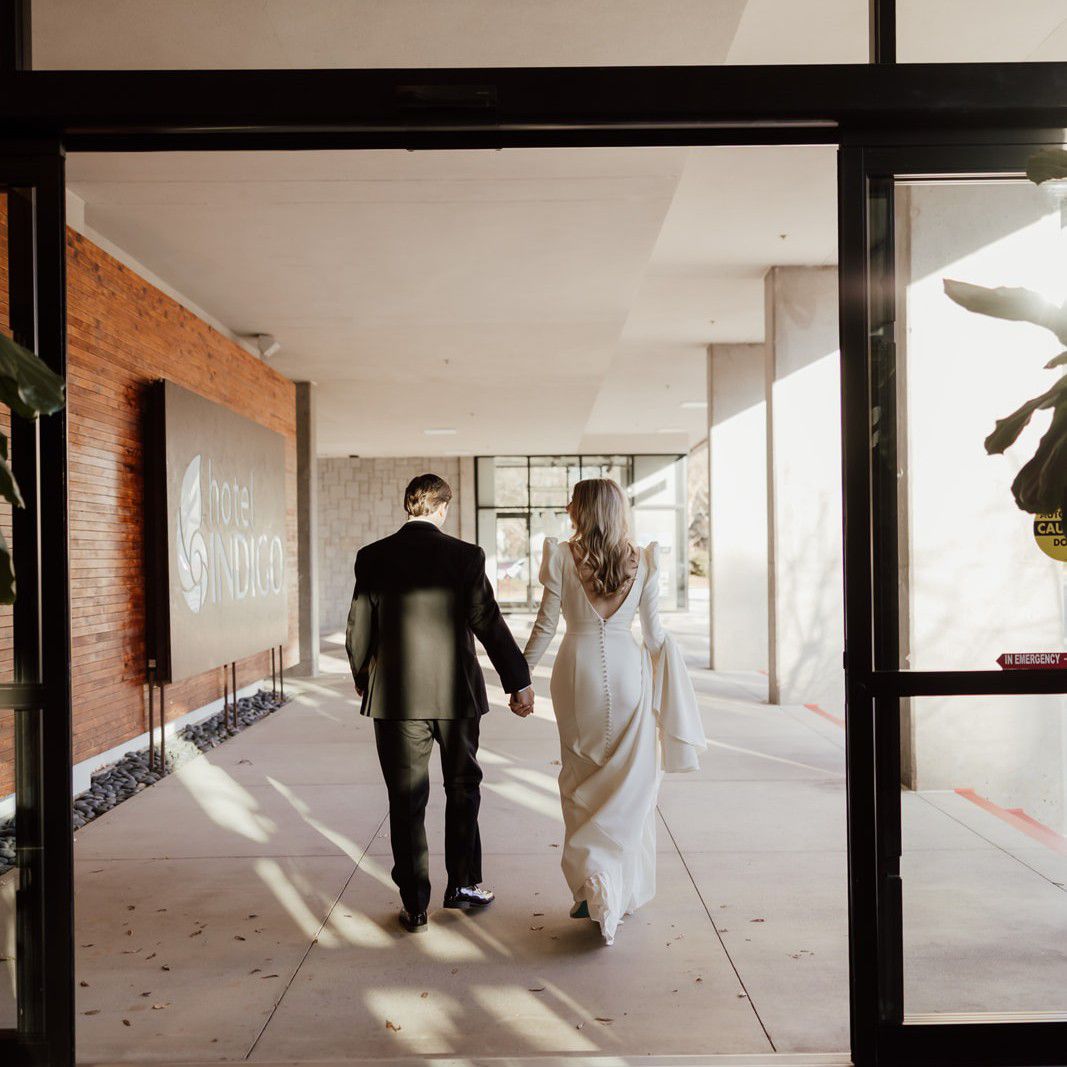 Newly weds walking out the door