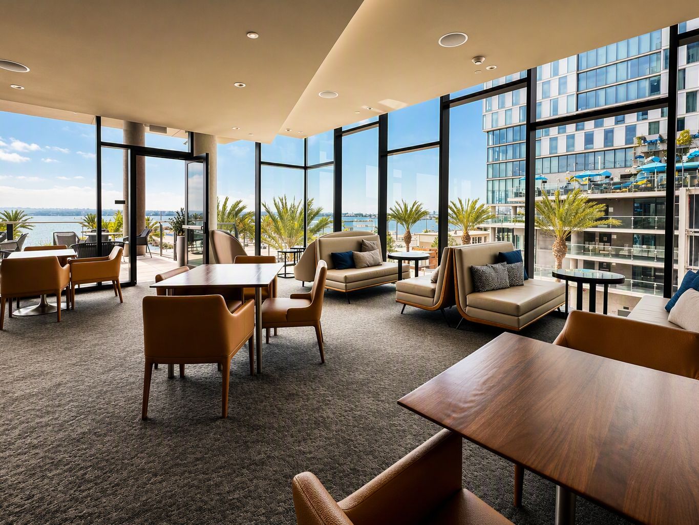 Club InterContinental lounge with floor-to-ceiling windows overlooking San Diego Bay.