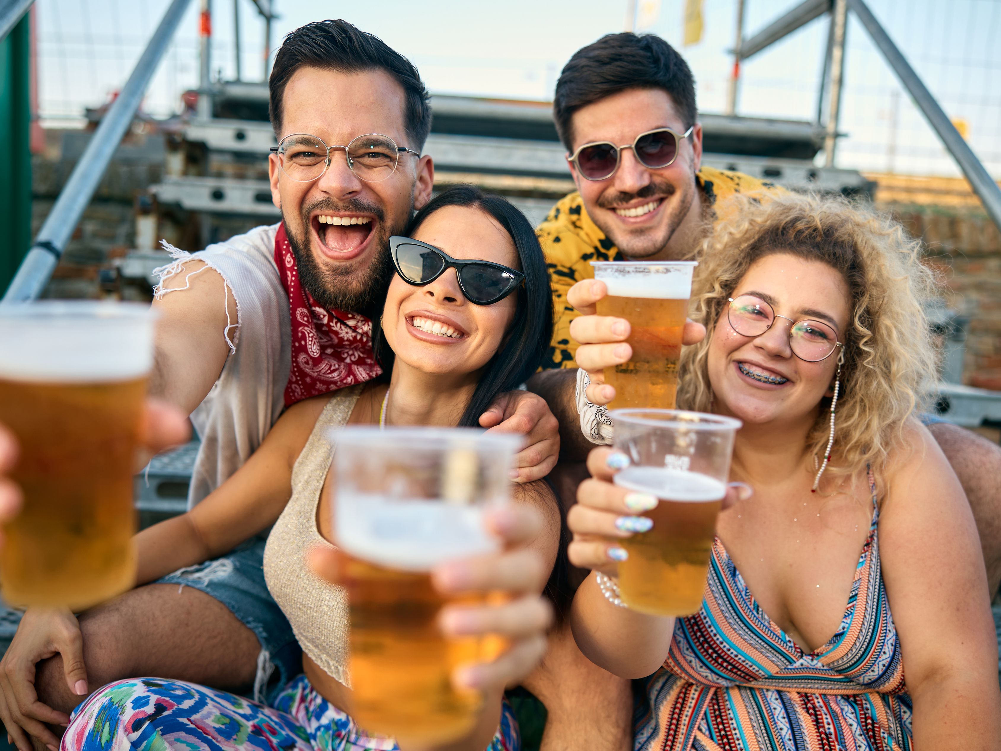 Friends drinking beer at festival