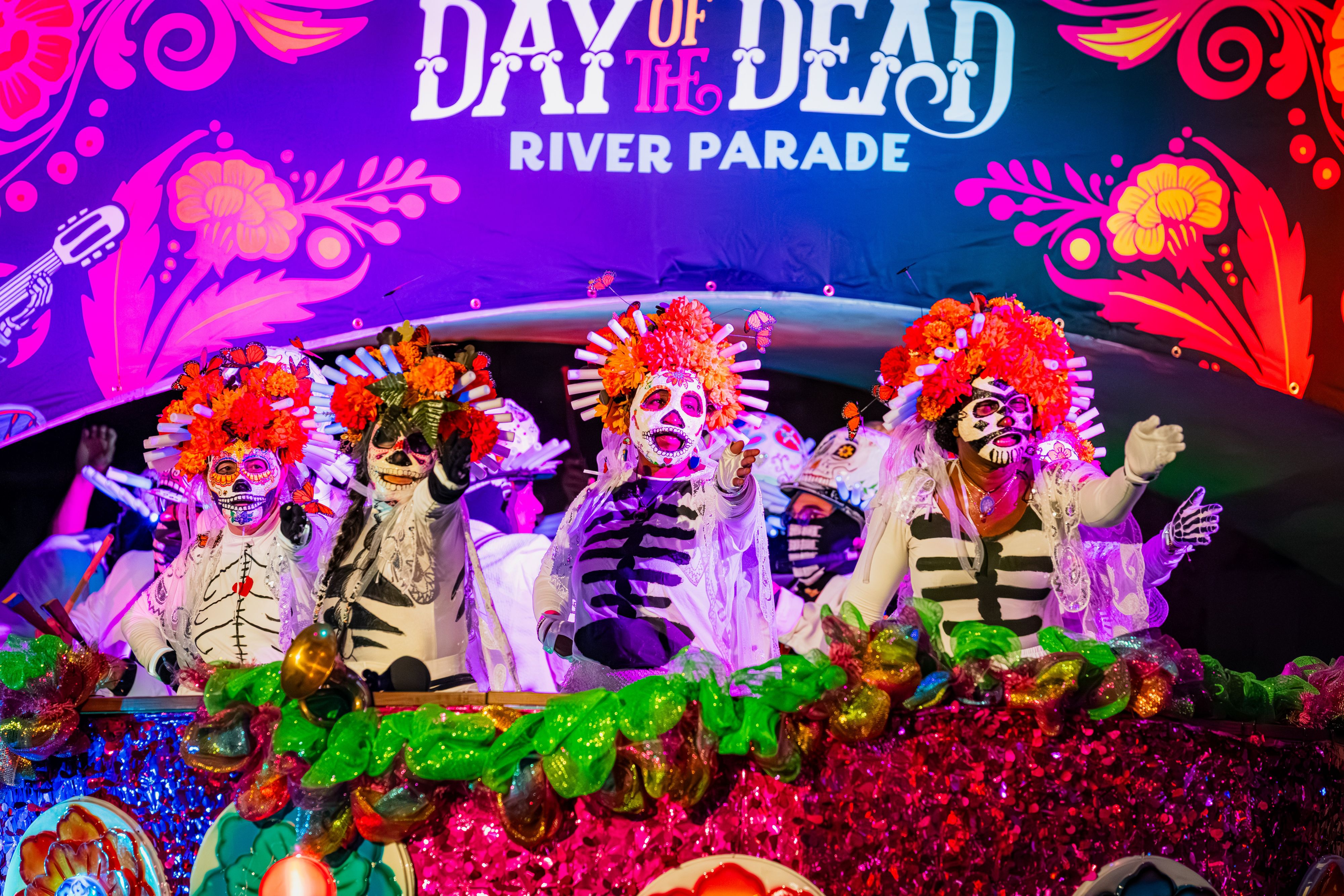 Day of the Dead River Parade float with costumed performers