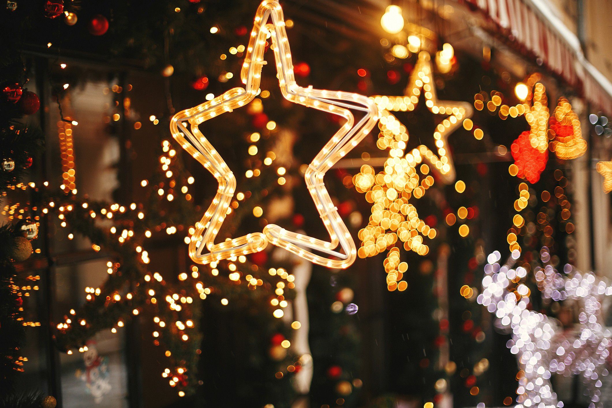 Festive star-shaped holiday lights decorating a storefront