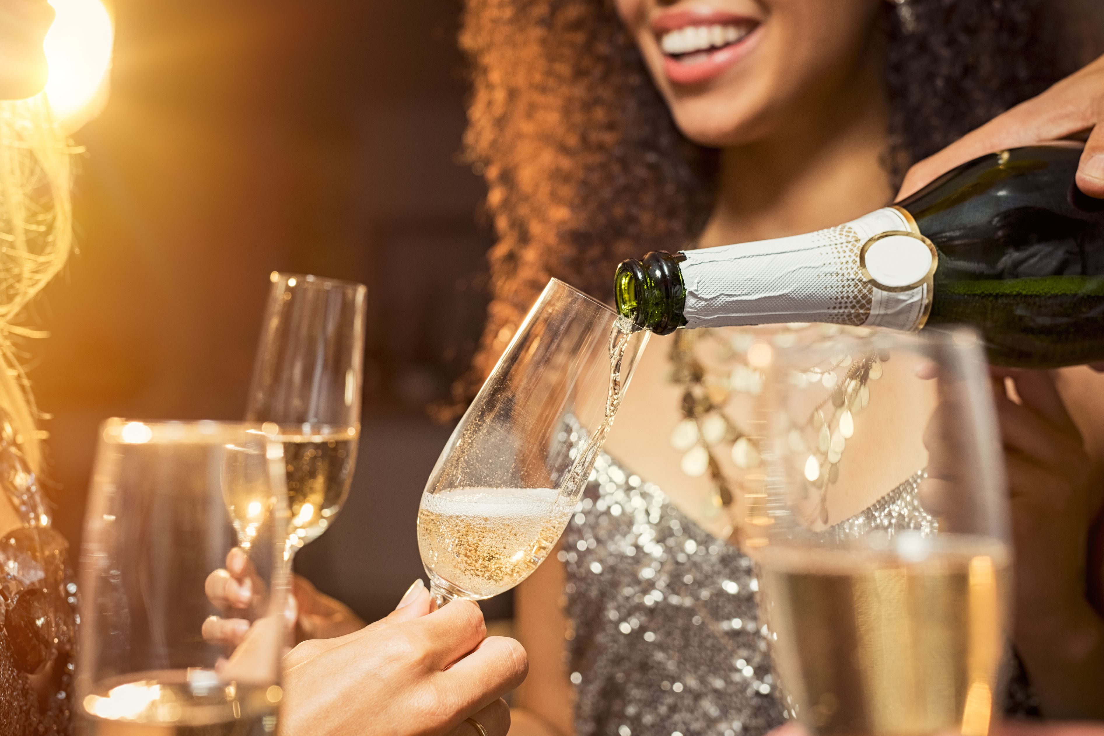 Friends enjoying champagne at NYE party