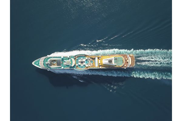 Aerial view large cruise ship at sea, Passenger cruise ship vessel, sailing across the Ksamil, Albania. View from drone.