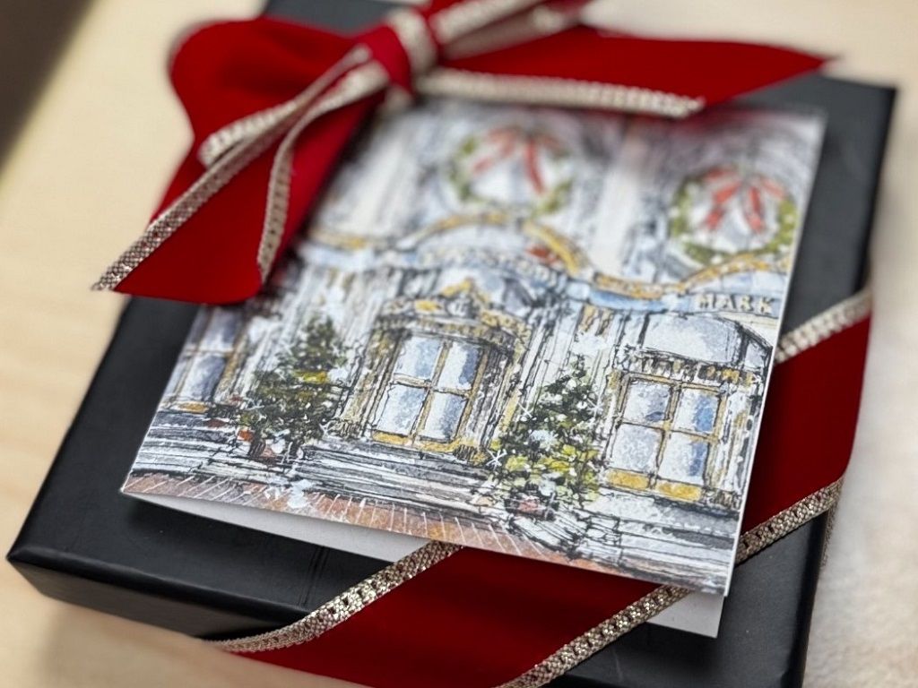 Wrapped present with red and gold bow