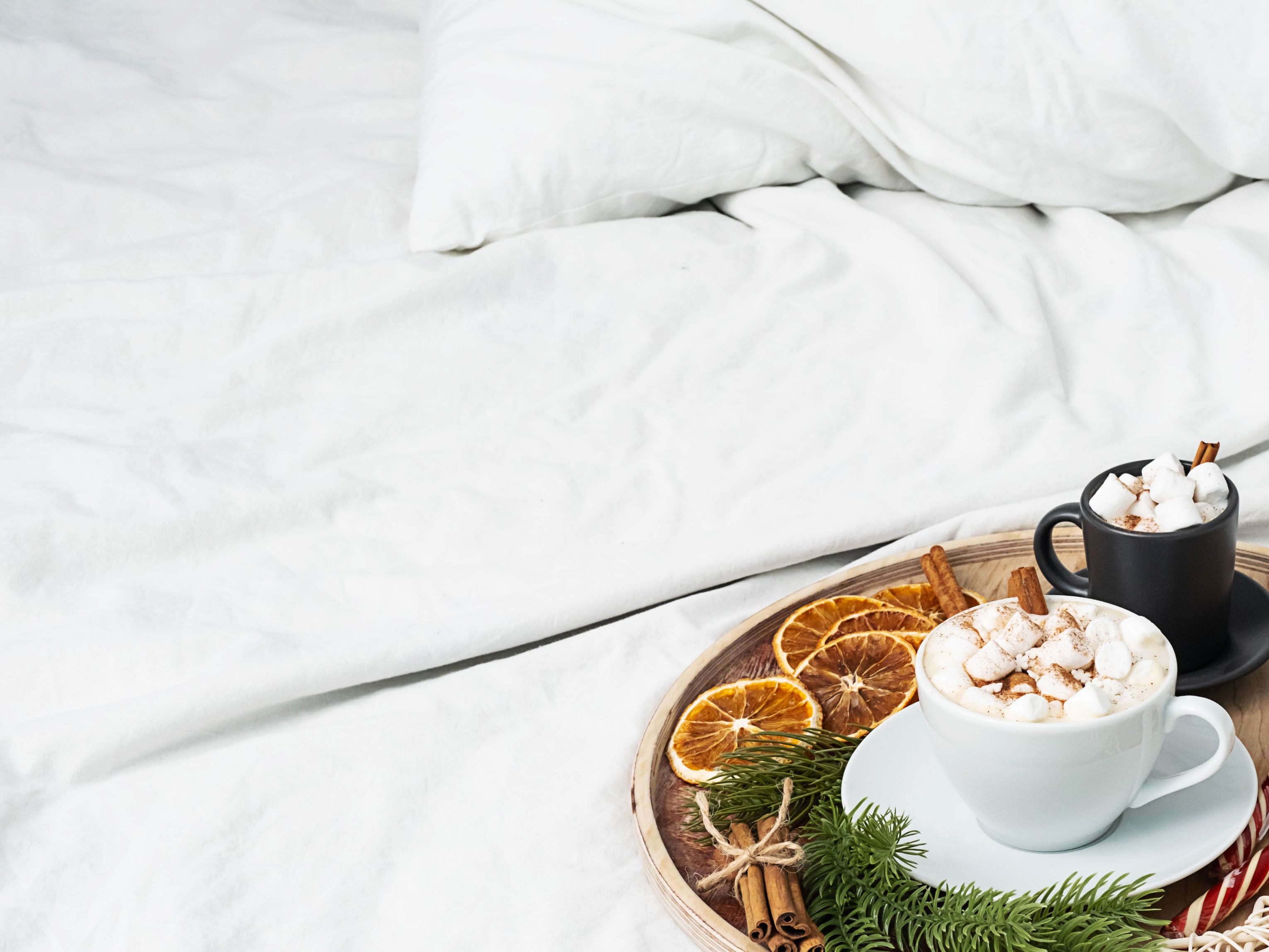 Holiday-decorated tray on hotel bed