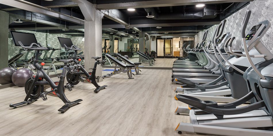 Hotel Spero fitness center featuring ellipticals, pelotons and various gym equipment