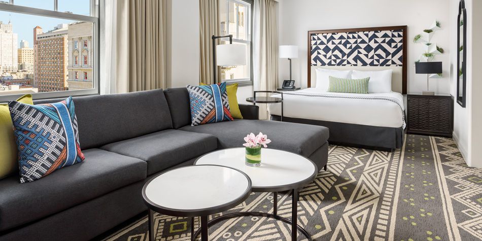 Hotel Spero Urban Suite with living room and bed