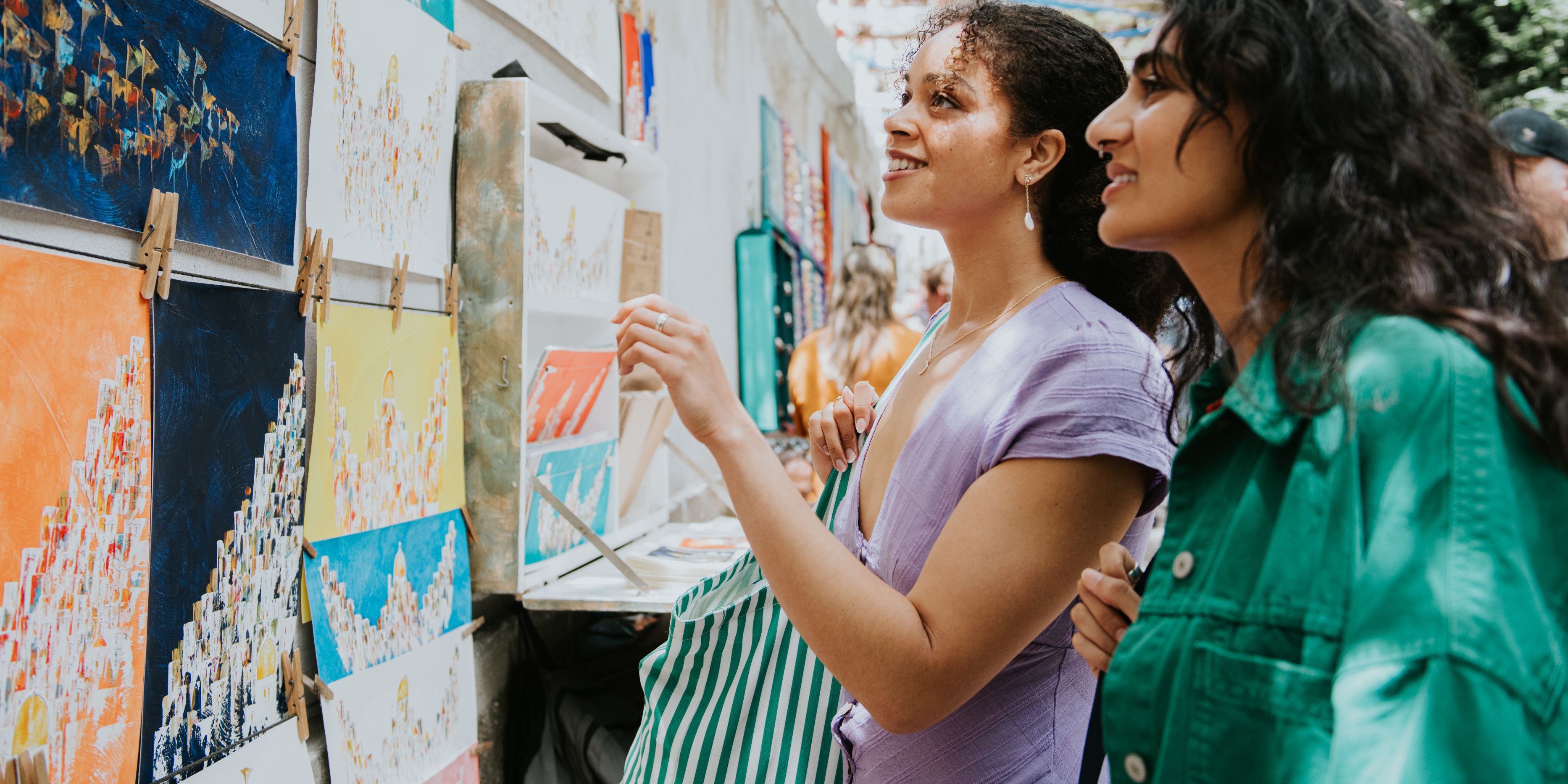 Two women admiring local art.