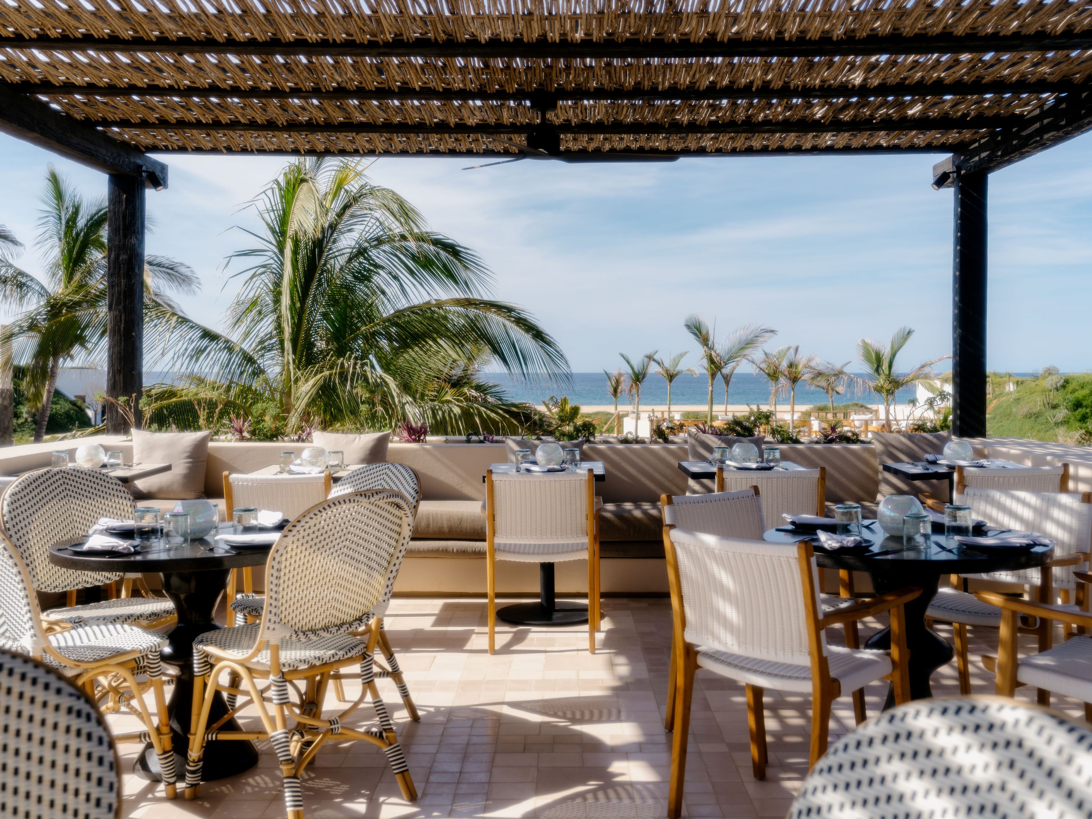 Centro outdoor seating with beach views.
