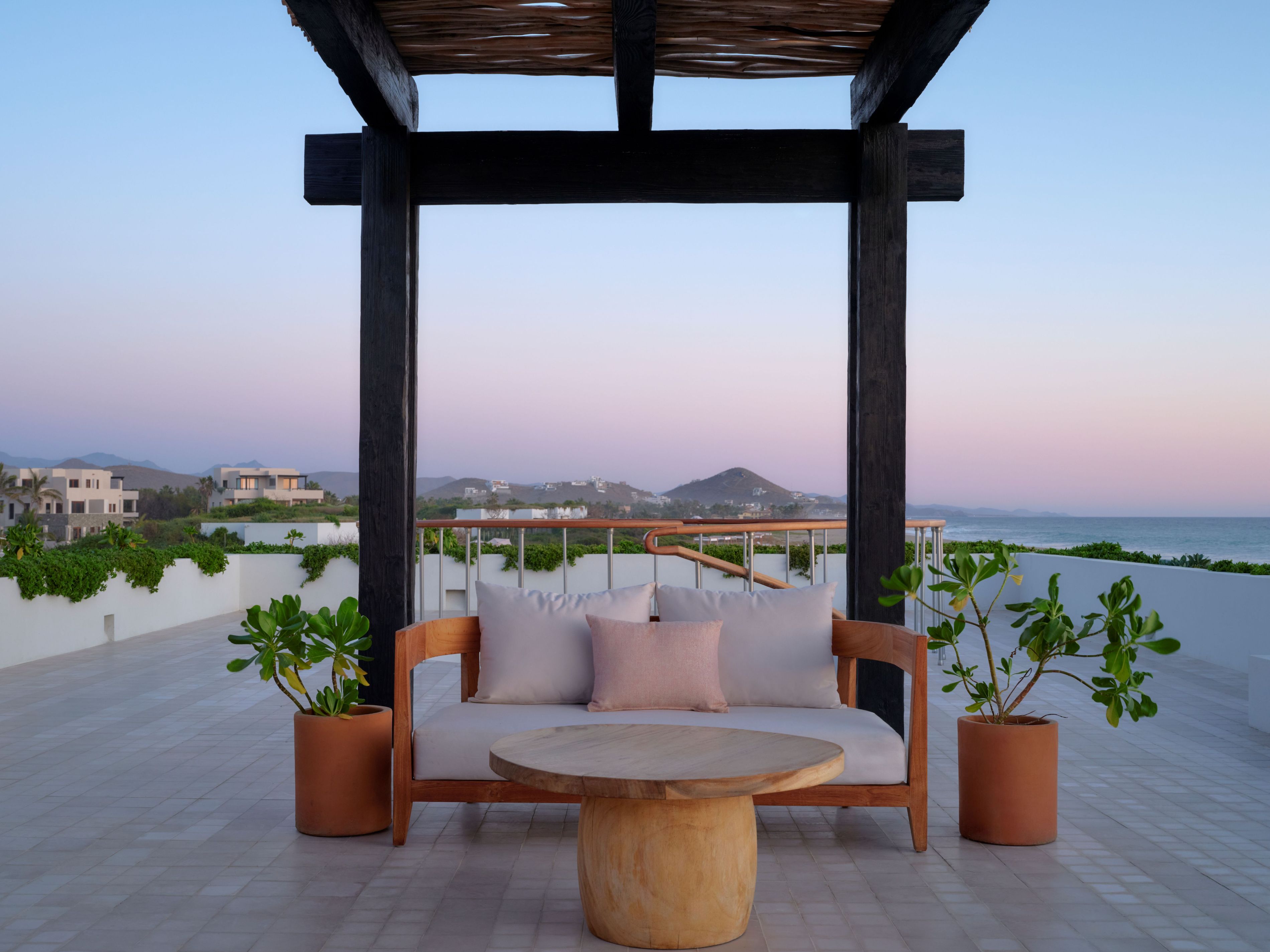 Cozy couch seating at Kahal outdoor area.