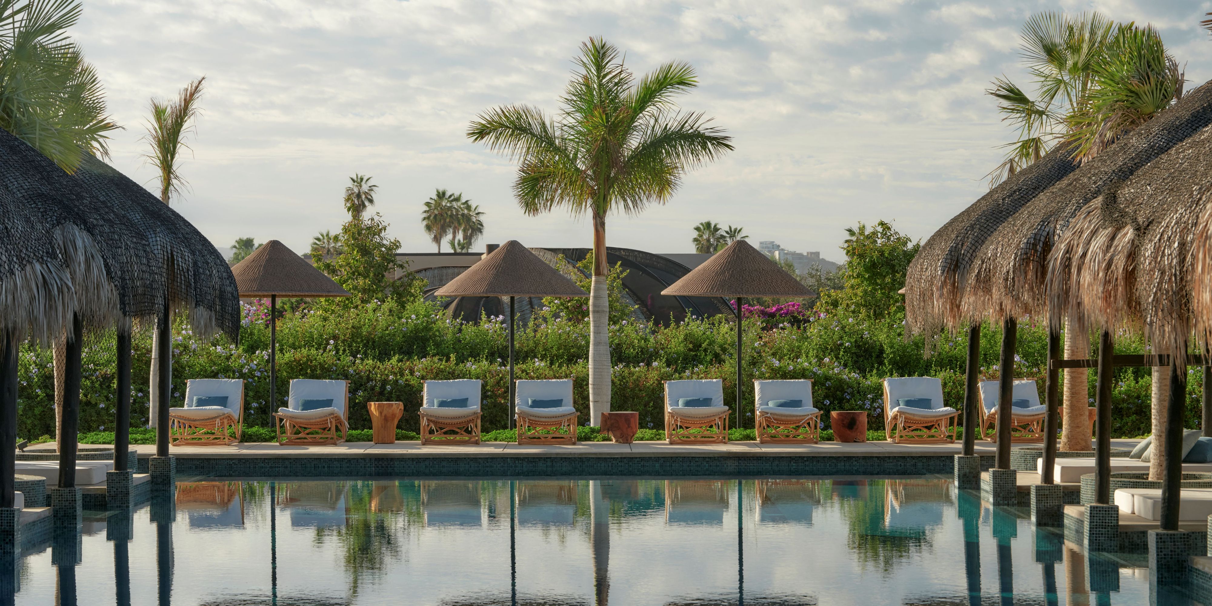 Relaxing spa pool with lounge chairs.