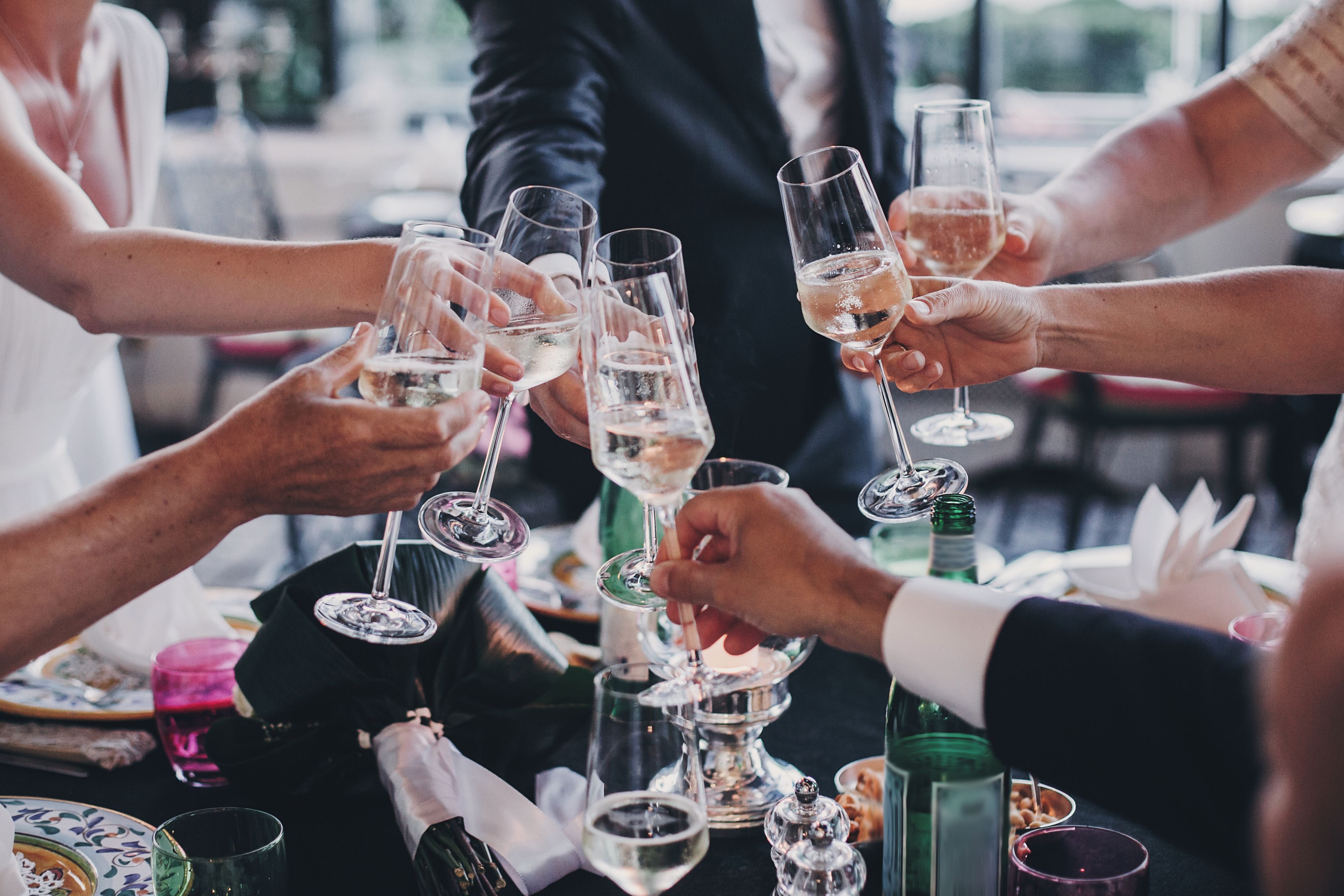 group of people toasting with champagne