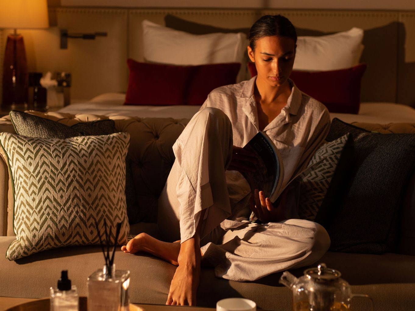Guest sitting on couch in suite
