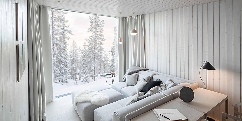 Guest room with view of snow capped trees