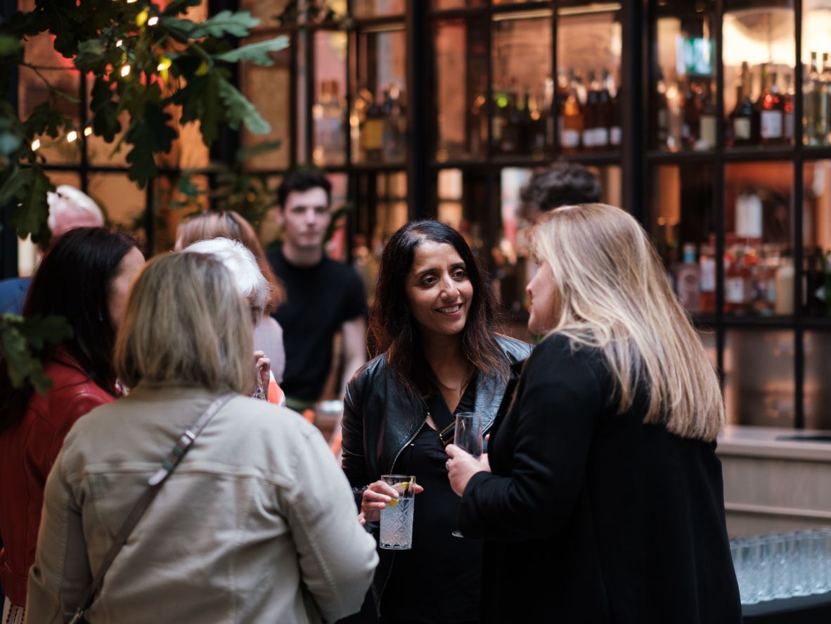 Guests socializing in hotel lobby