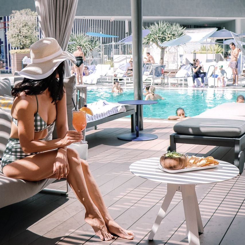 Guest enjoying cabana space next to pool