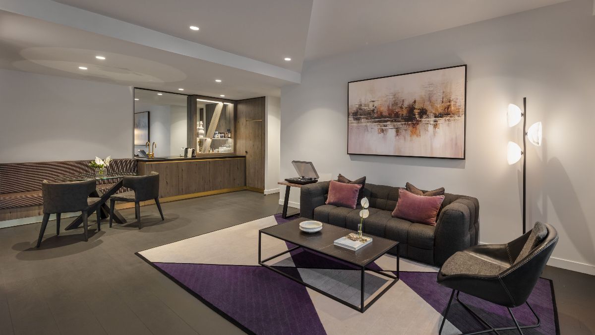 Modern living room with dining area and kitchen, stylish furnishings
