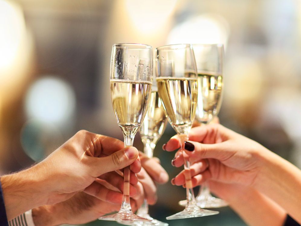 People cheering Champagne