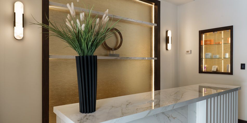 Luxury spa reception with marble desk and decor