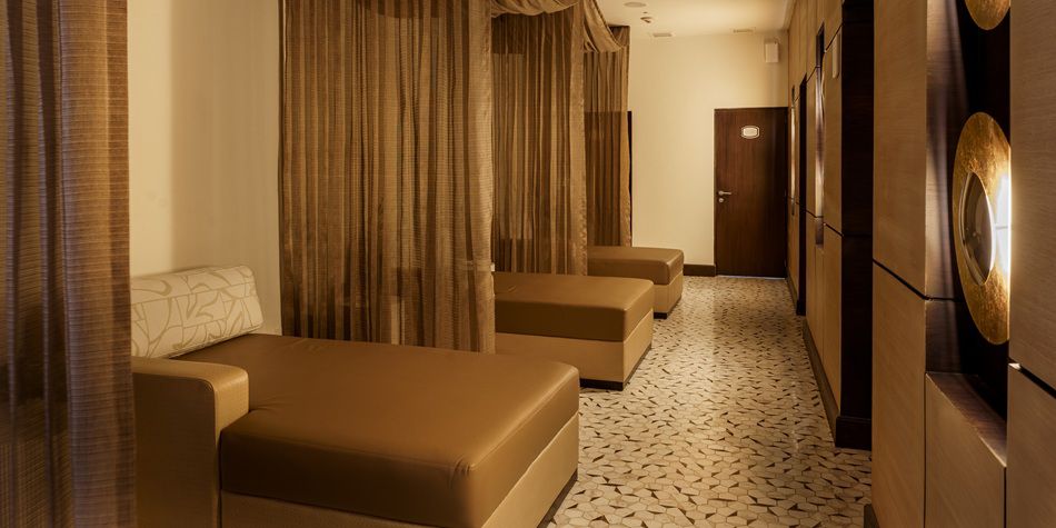 Serene spa relaxation lounge with curtained daybeds