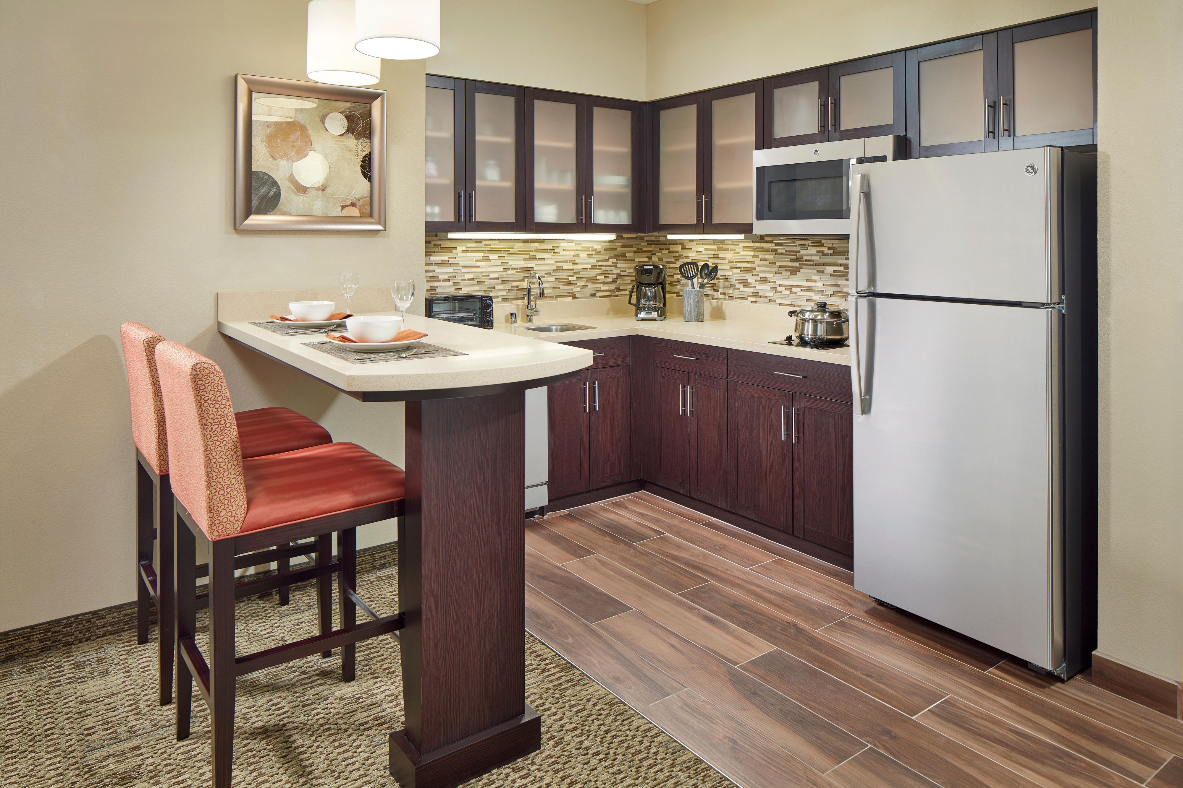 Get the taste of home and make your meals in the comfort of your suite! Our cooktop stove, full-size refrigerator, microwave, dishwasher, garbage disposal, toaster, coffee machine, dishes and utensils make it easy! 