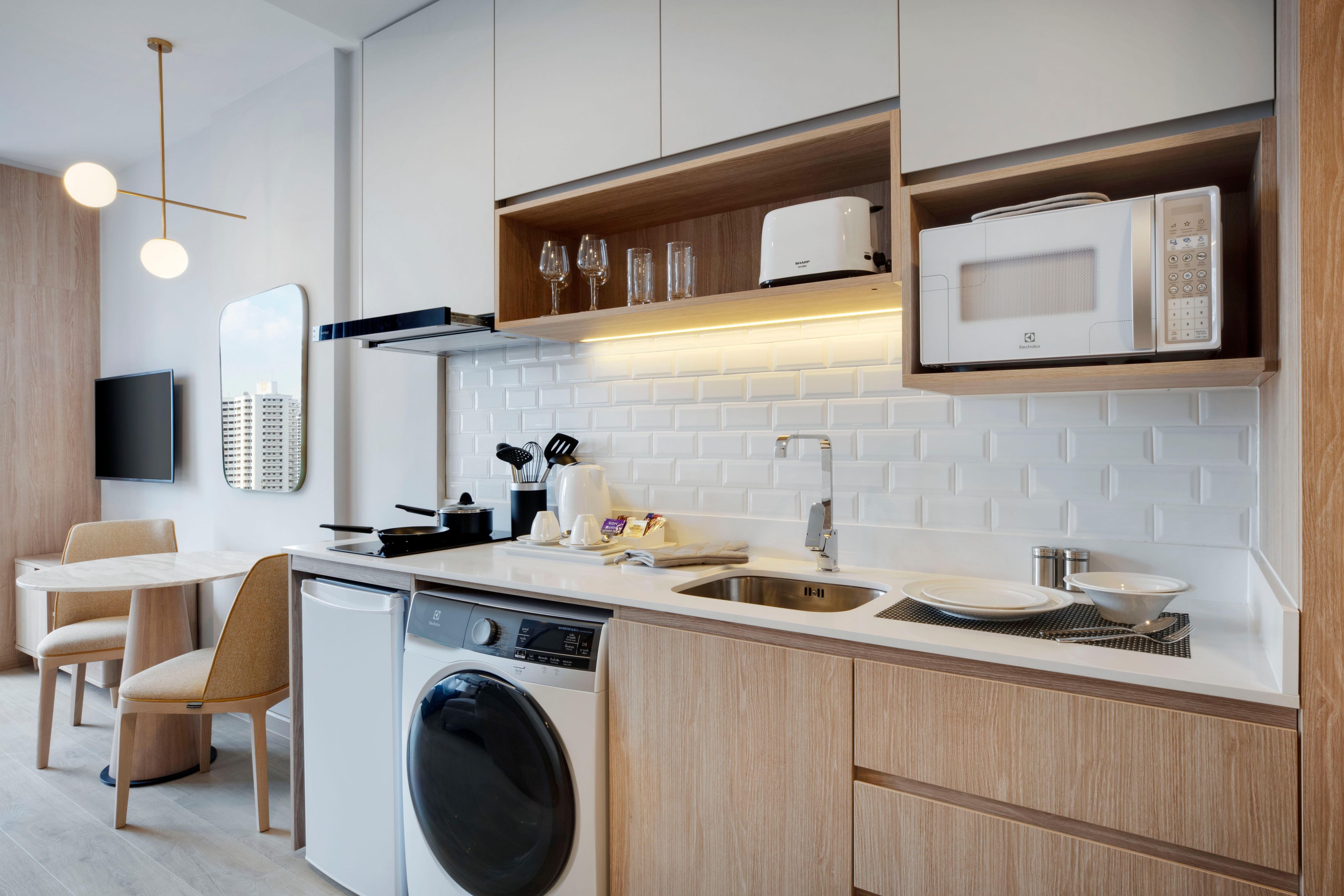 Enjoy the comfort of our premium bedding, plush sofa, and the conveniences of our fully-equipped kitchen, in-suite laundry machine and dryer. With a balcony opening out to Bangkok’s stunning skyline, our spacious one- and two-bedroom suites help you make the most out of the city’s vibrant life.

