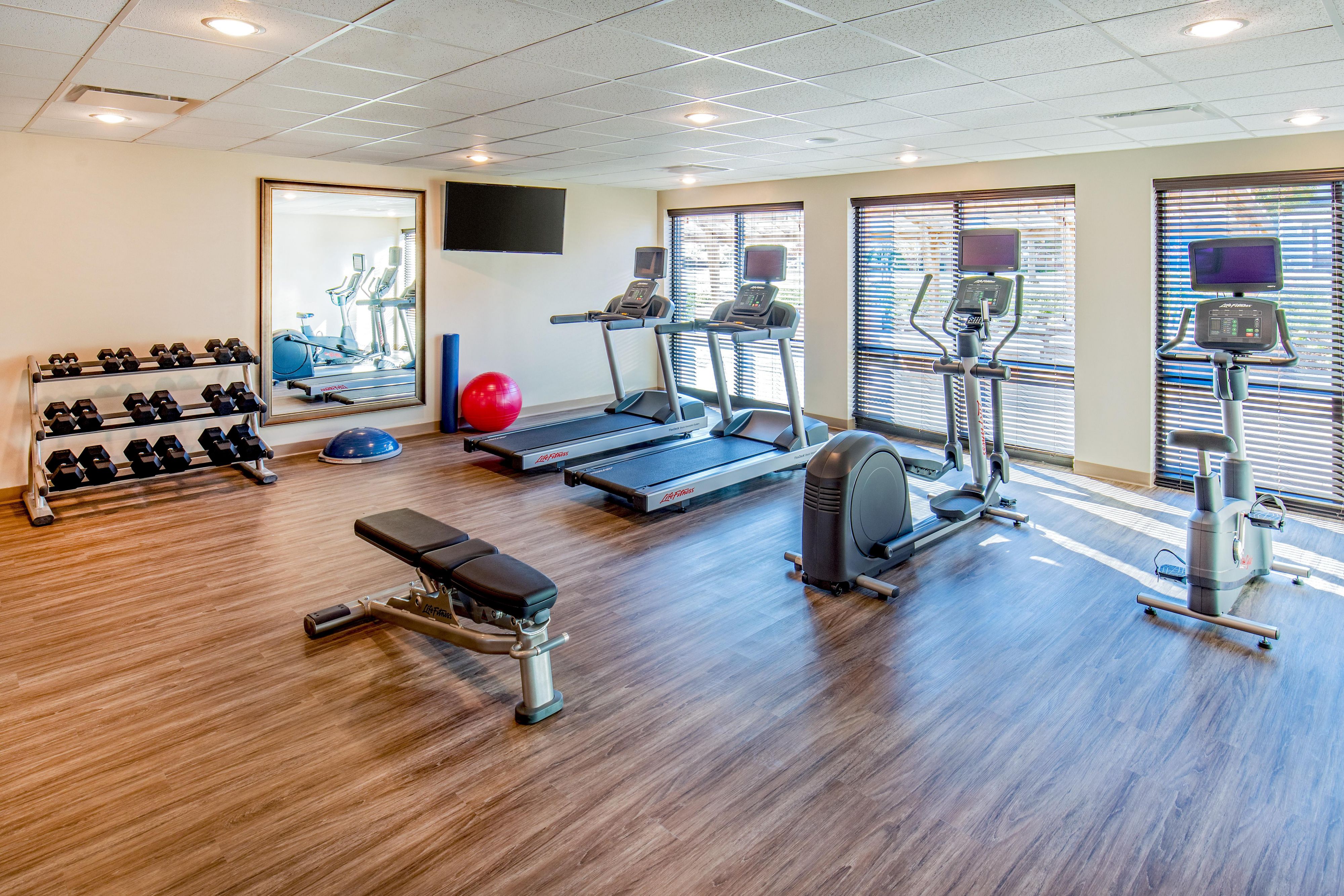 Embrace your workout in our 24/7 on-site fitness center & pool.