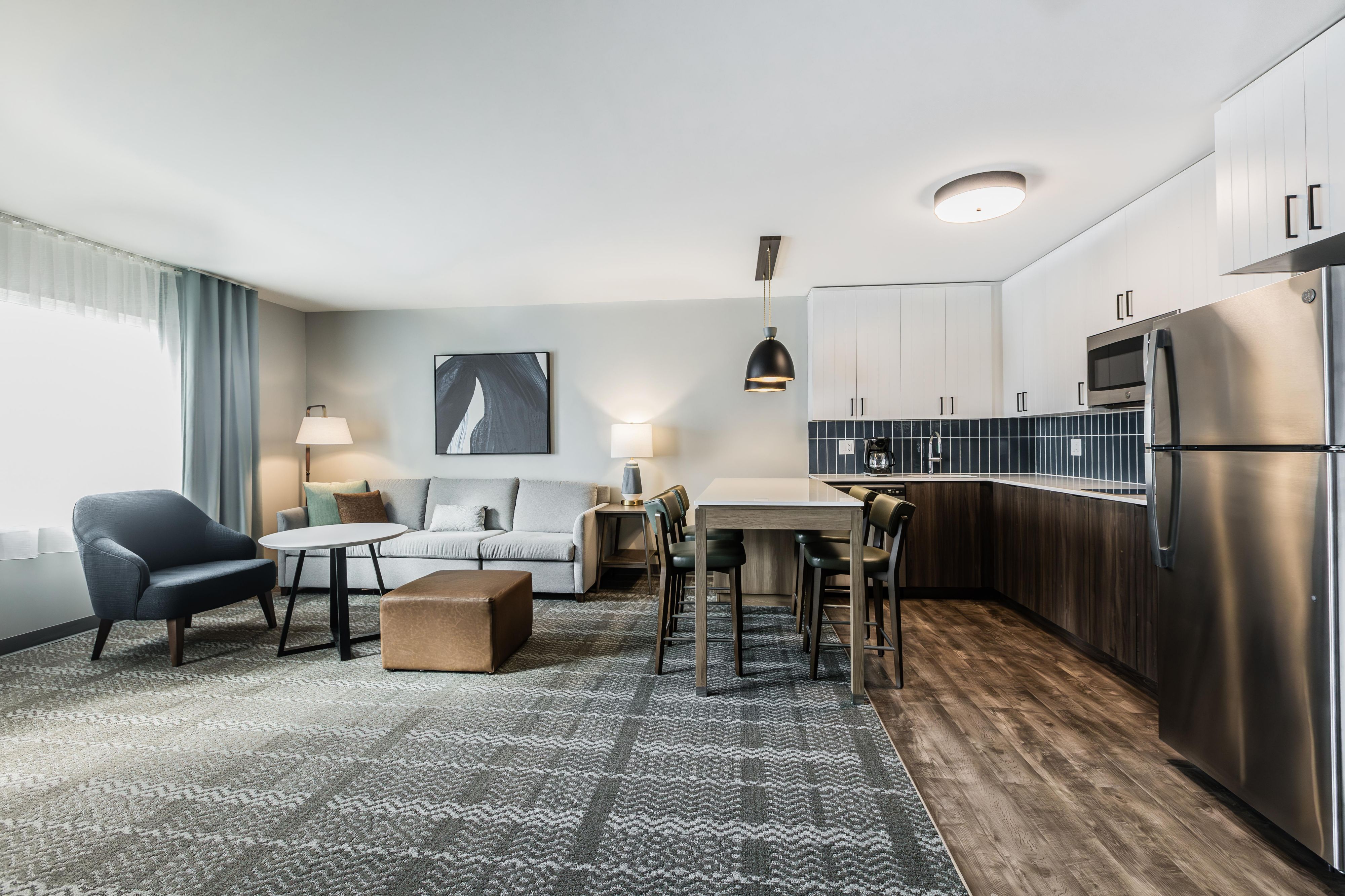 Every suite features a full kitchen with all the essentials, but we are the only hotel in the city offering two-bedroom suites with full kitchens, ideal for small groups or families. Featuring a king bed, two double beds, two master bathrooms, a separate living area, a full kitchen, plus a cozy twin-size pull-out sofa bed.