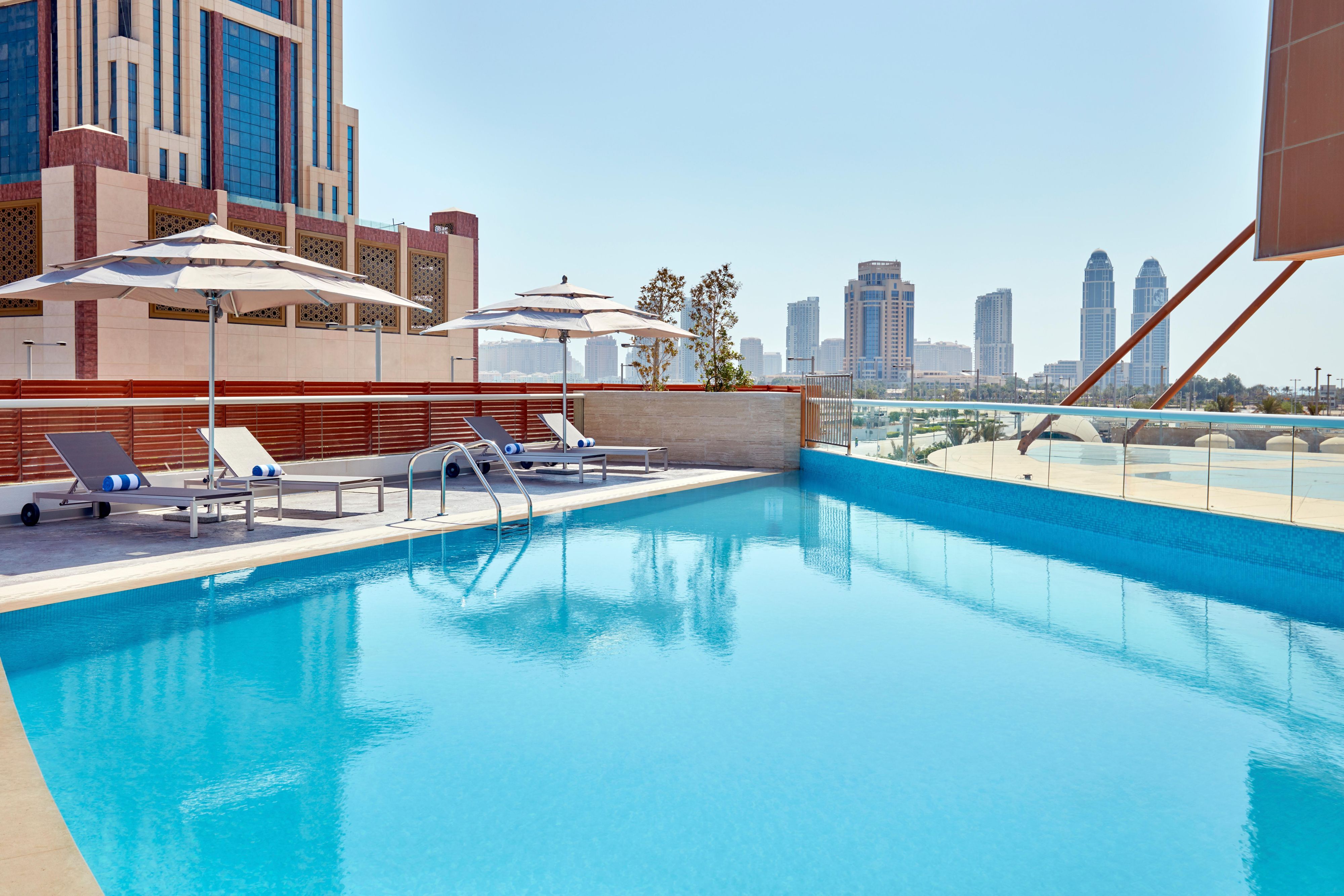 The outdoor pool, located on the 2nd floor, overlooks the beautiful city of Lusail and is accessible to all guests. Book your stay with us now!