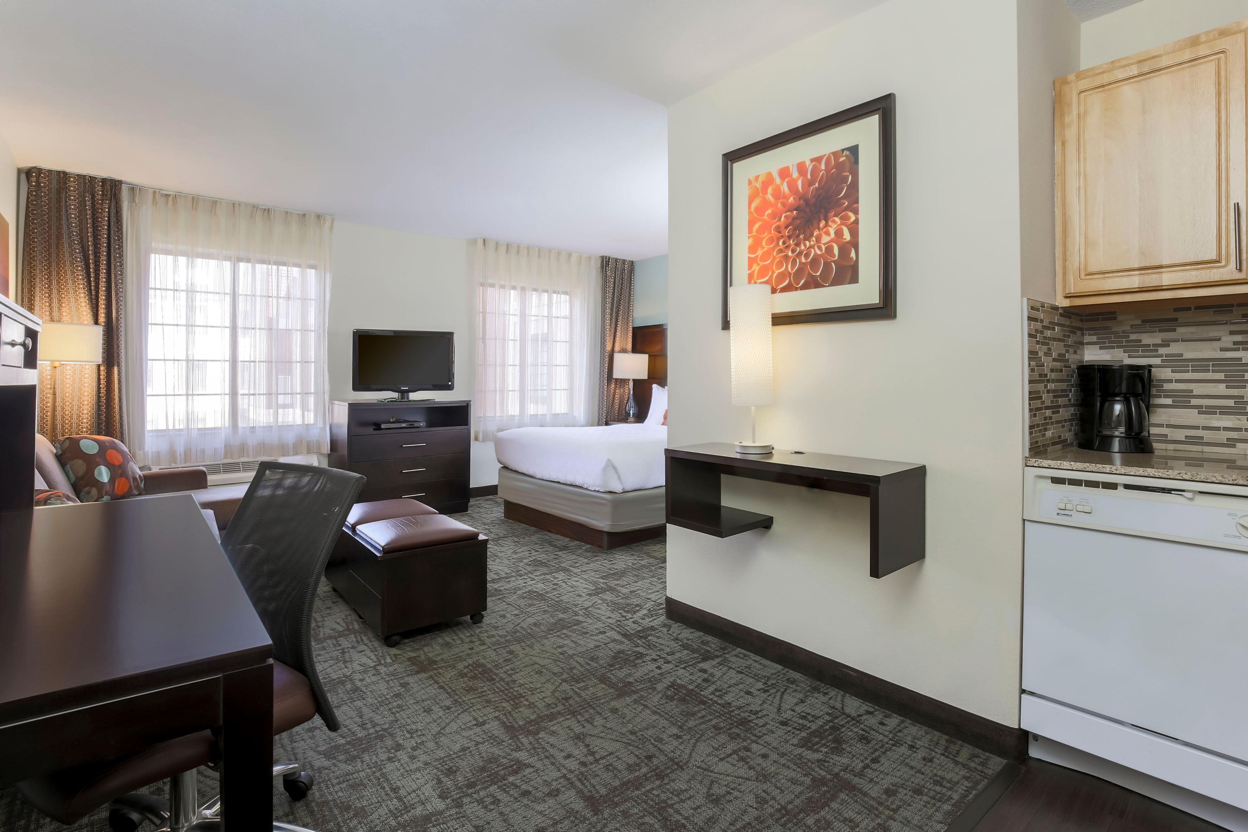 Our large suites feature a sitting area with pullout sofa, free Wi-Fi and a kitchen with stovetop, full size refrigerator, microwave and dishwasher. When you need to be away, let us be your home away from home. 