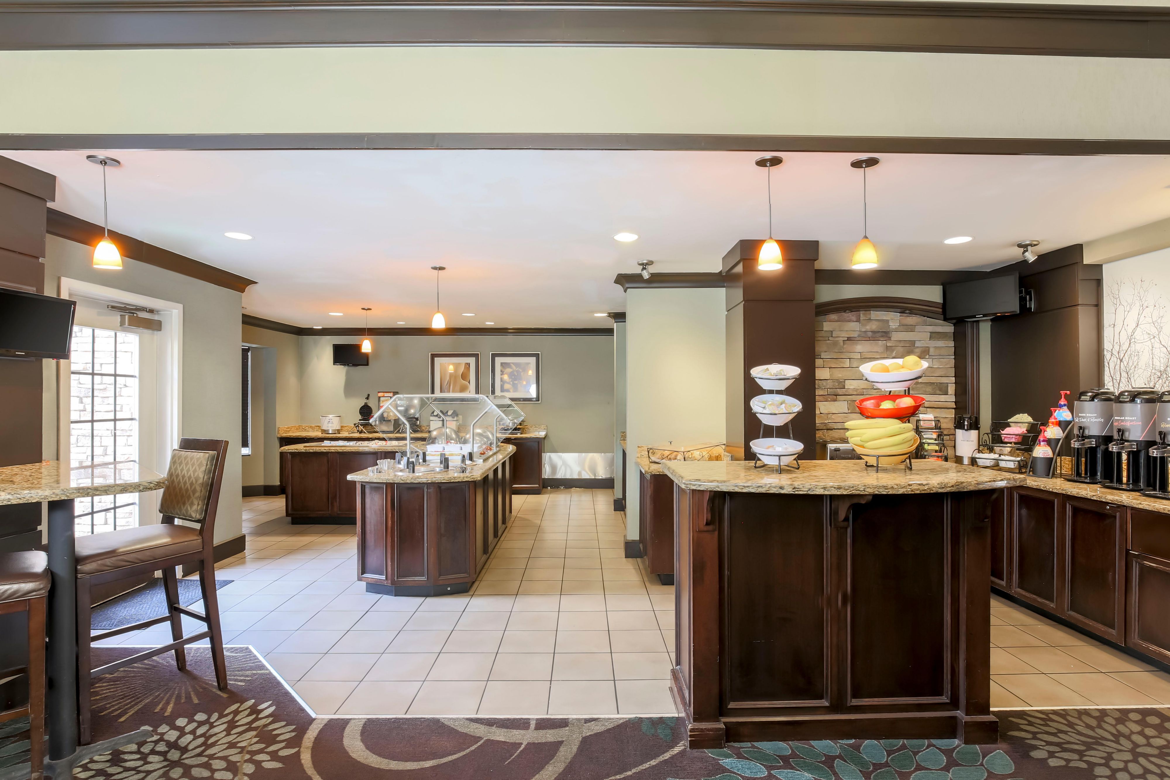 Our hotel’s complimentary breakfast features a hot breakfast sandwich and a variety of continental breakfast items. 