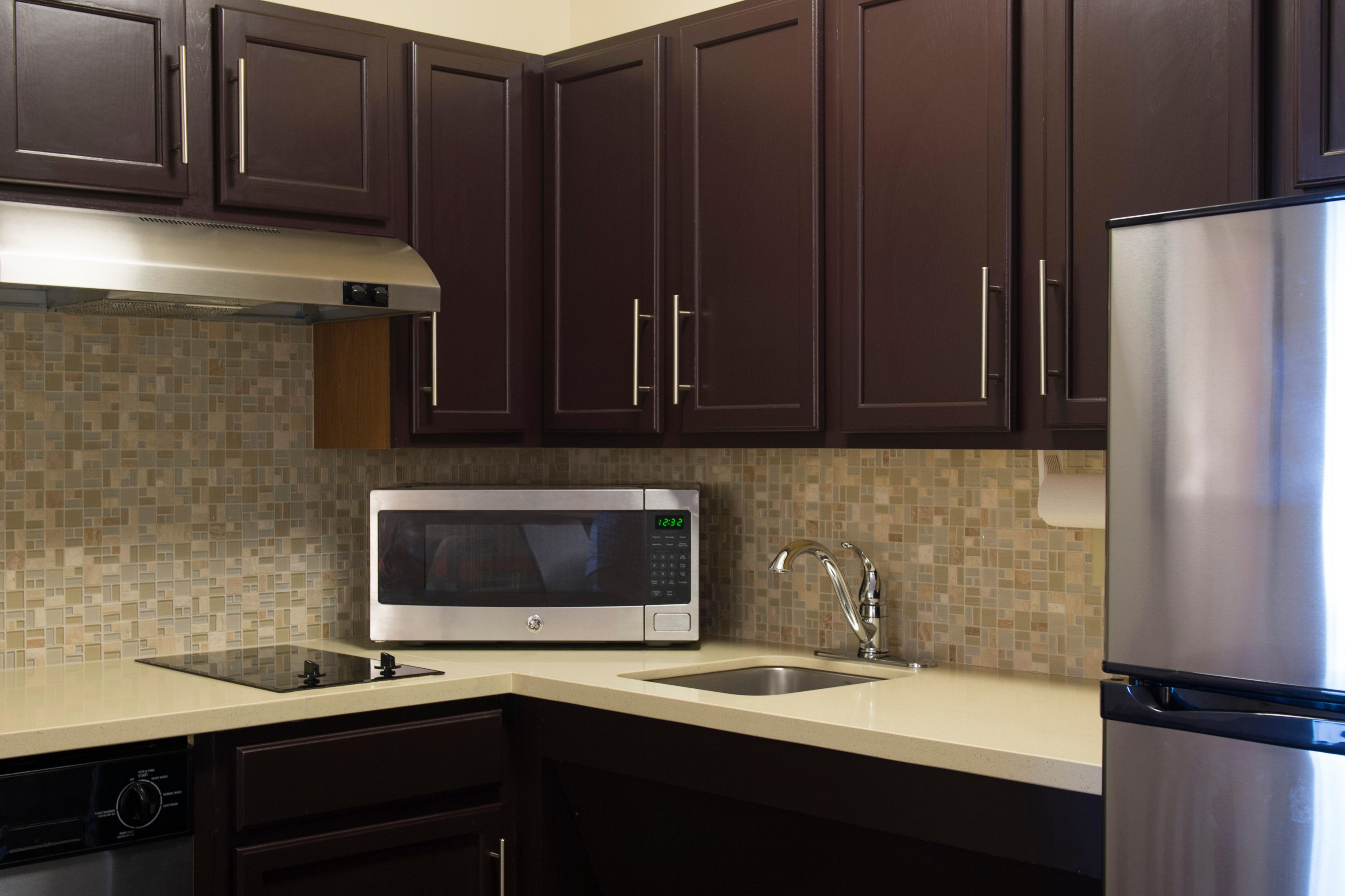 Fully equipped kitchens in each room allows guests the flexibility to cook their own meals, complete with a two burner stovetop, microwave, full-size refrigerator and dishwasher. 