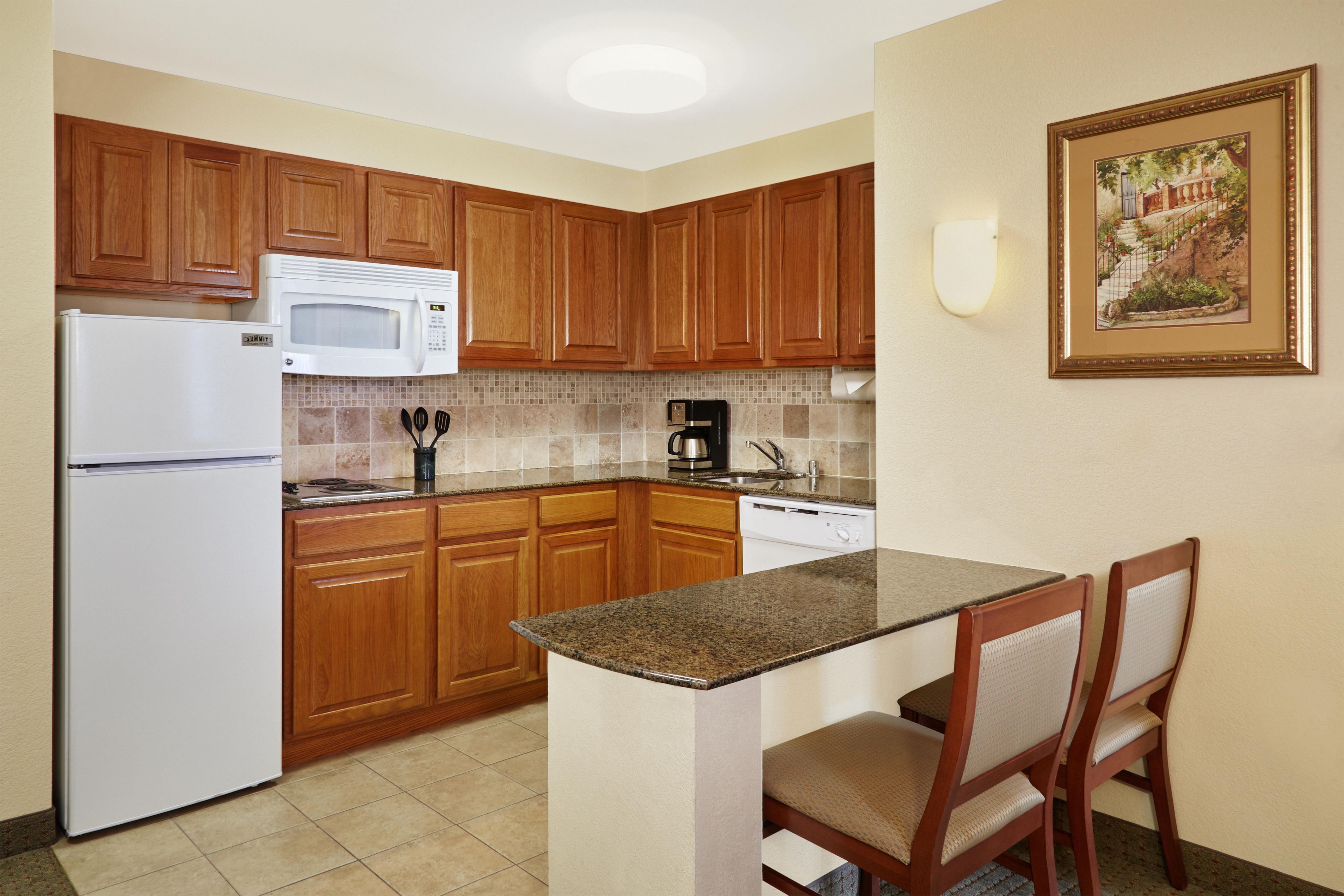 Fully equipped kitchens in each room allow guests the flexibility to cook their own meals, complete with a two burner stovetop, microwave, full-size refrigerator and dishwasher.
