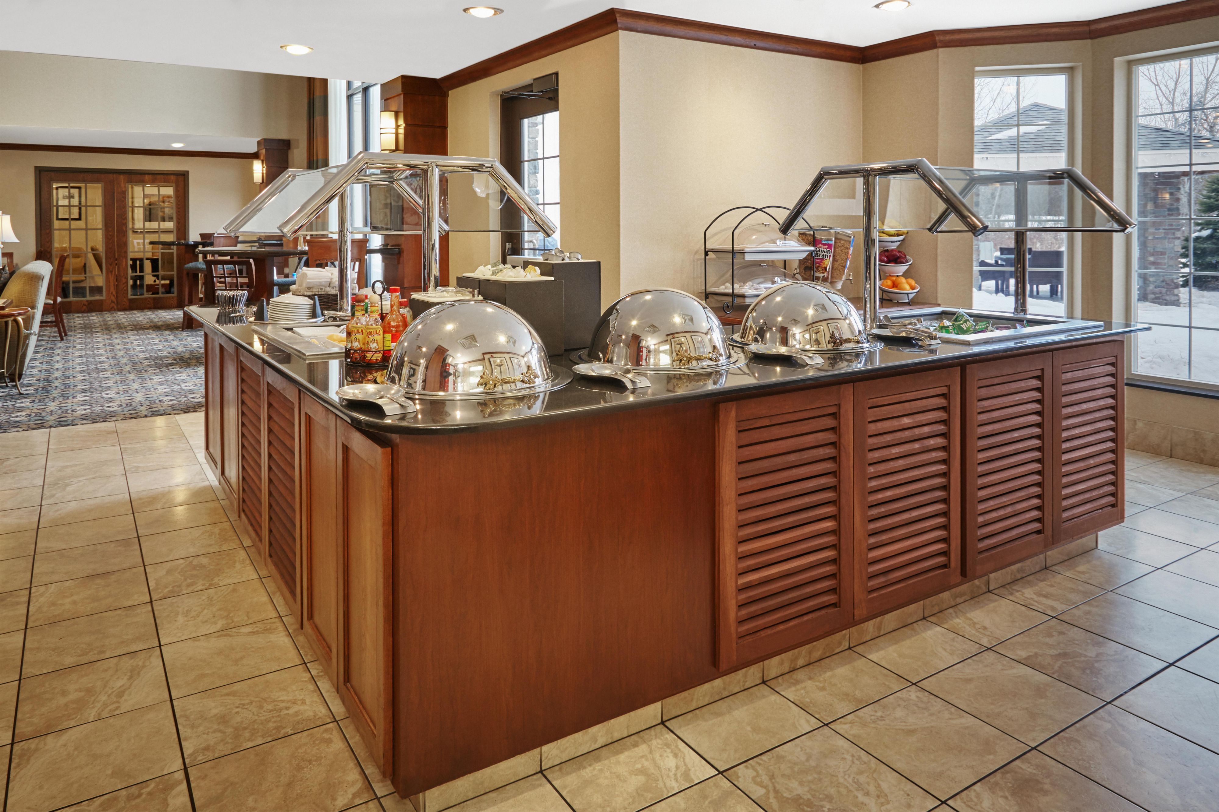 Start each day right with our free hot breakfast buffet. Enjoy some of your favorites. Freshly baked blueberry muffins, fresh fruit, eggs, breakfast meats, making your own waffles, and much more.