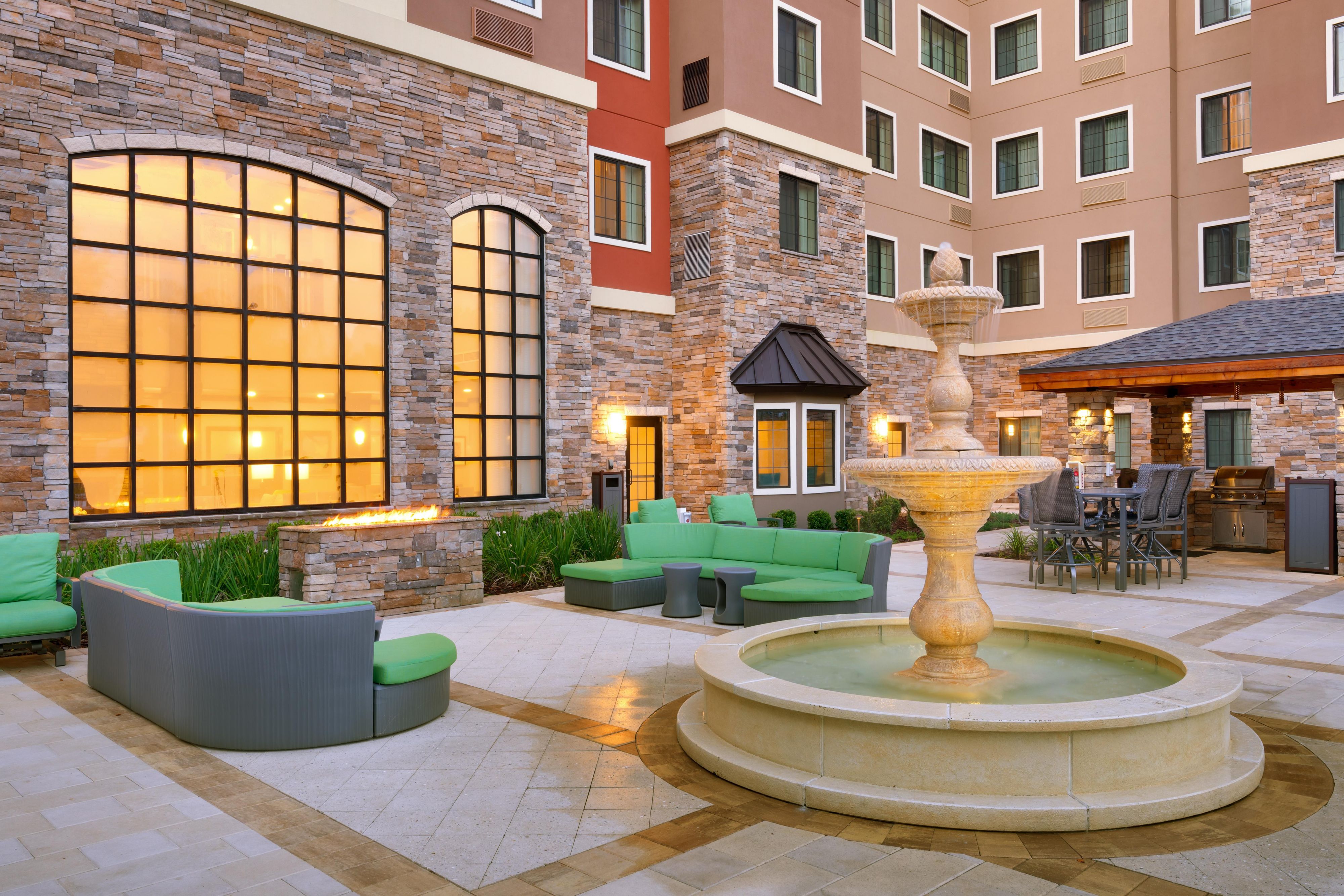 Our resort style patio offers firepit with lots of seating and tables for socializing.