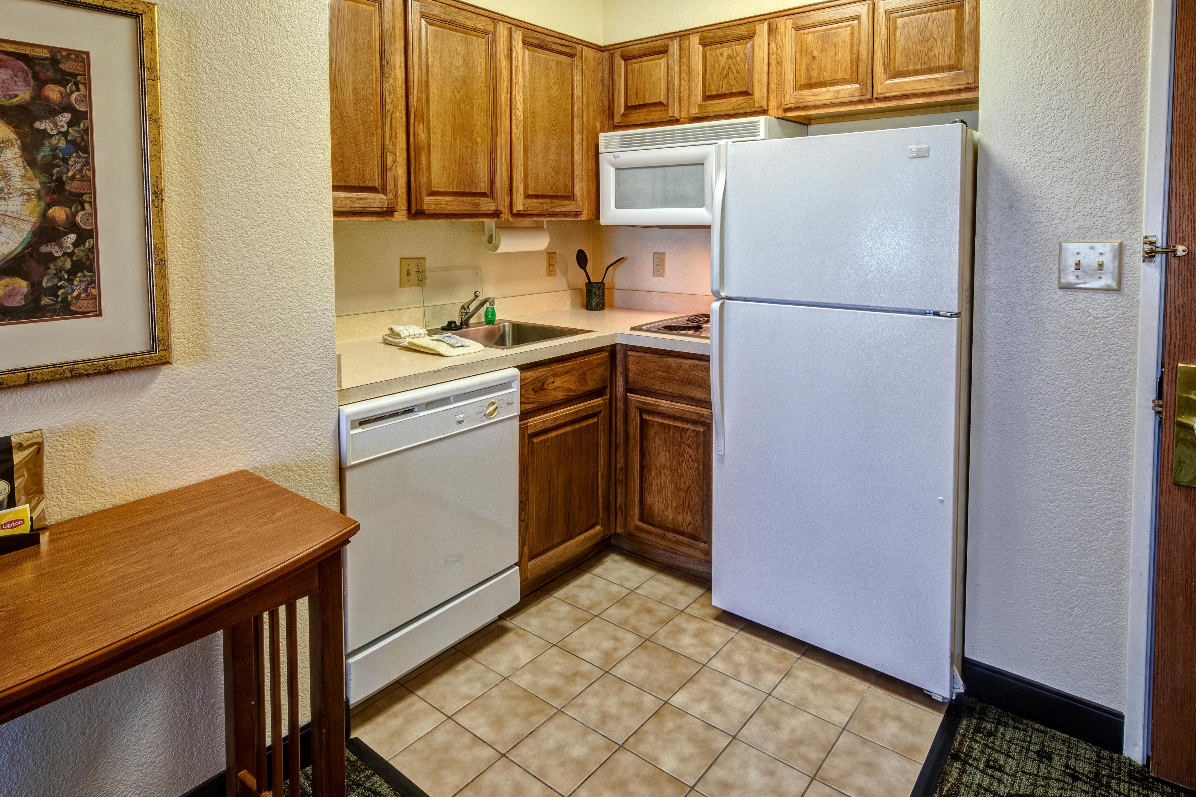 Make yourself at home with a fully-equipped kitchen in your suite featuring a two-burner cooktop stove, microwave, refrigerator, and dishwasher. 
