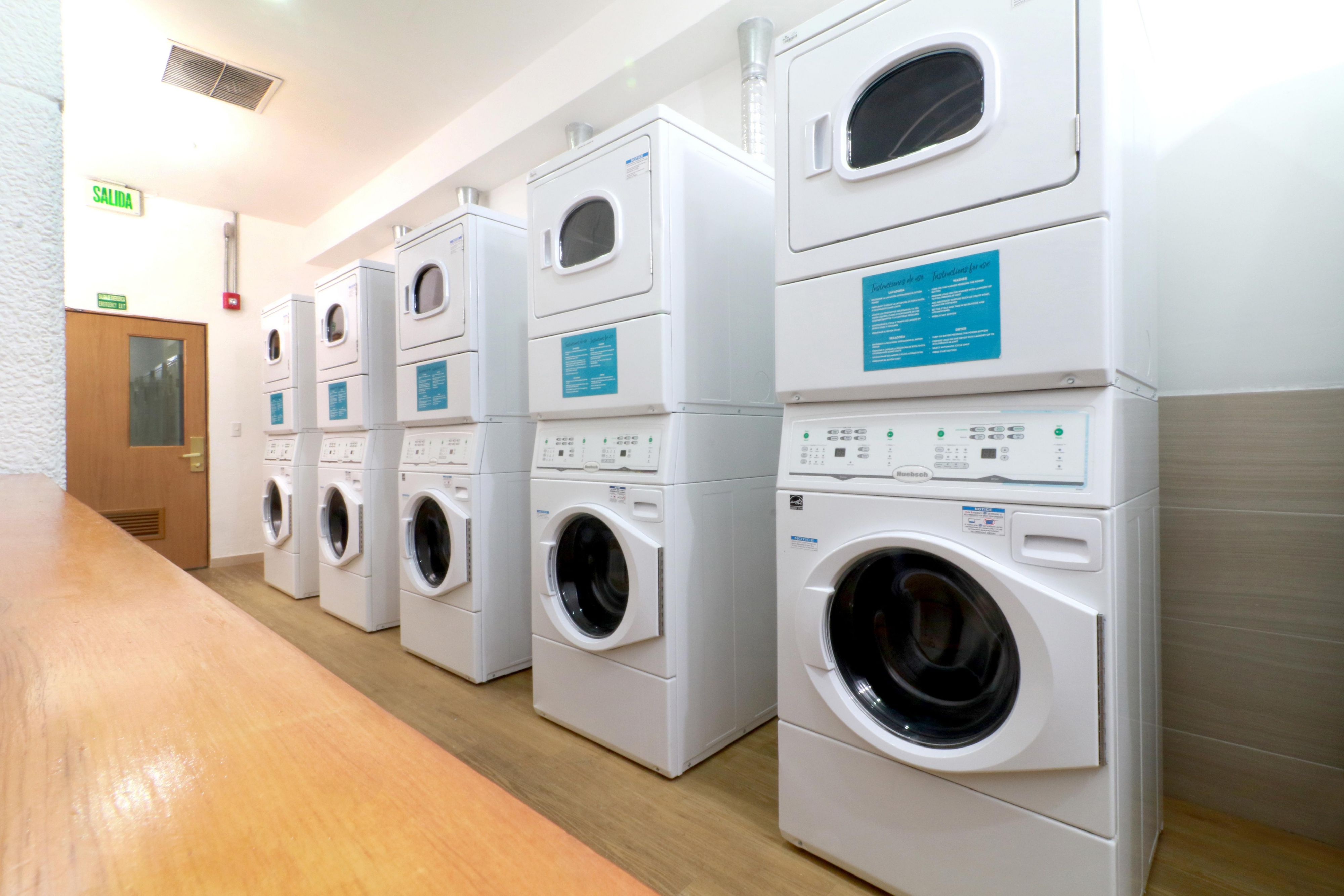 Free laundry center, available 24-hours a day, has 5 self-service washers and 5 dryers for the guest.