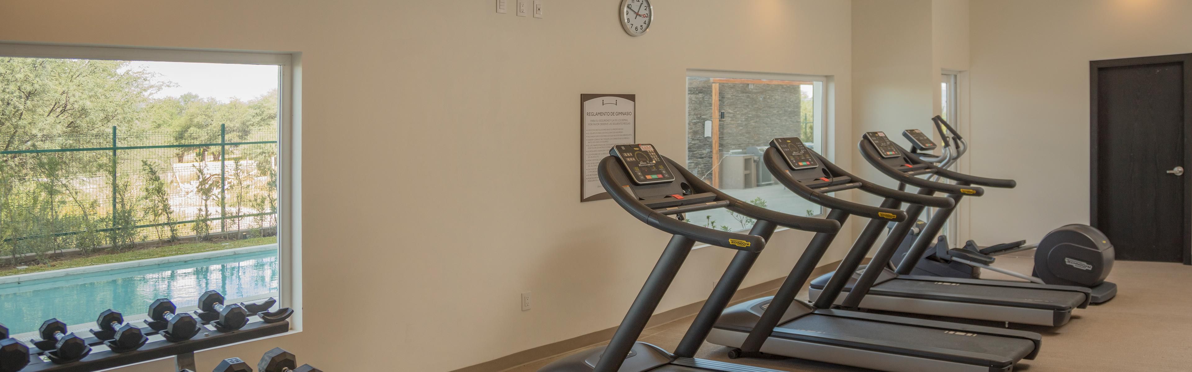 Experience comfort at a hotel with a pool and gym amenities.