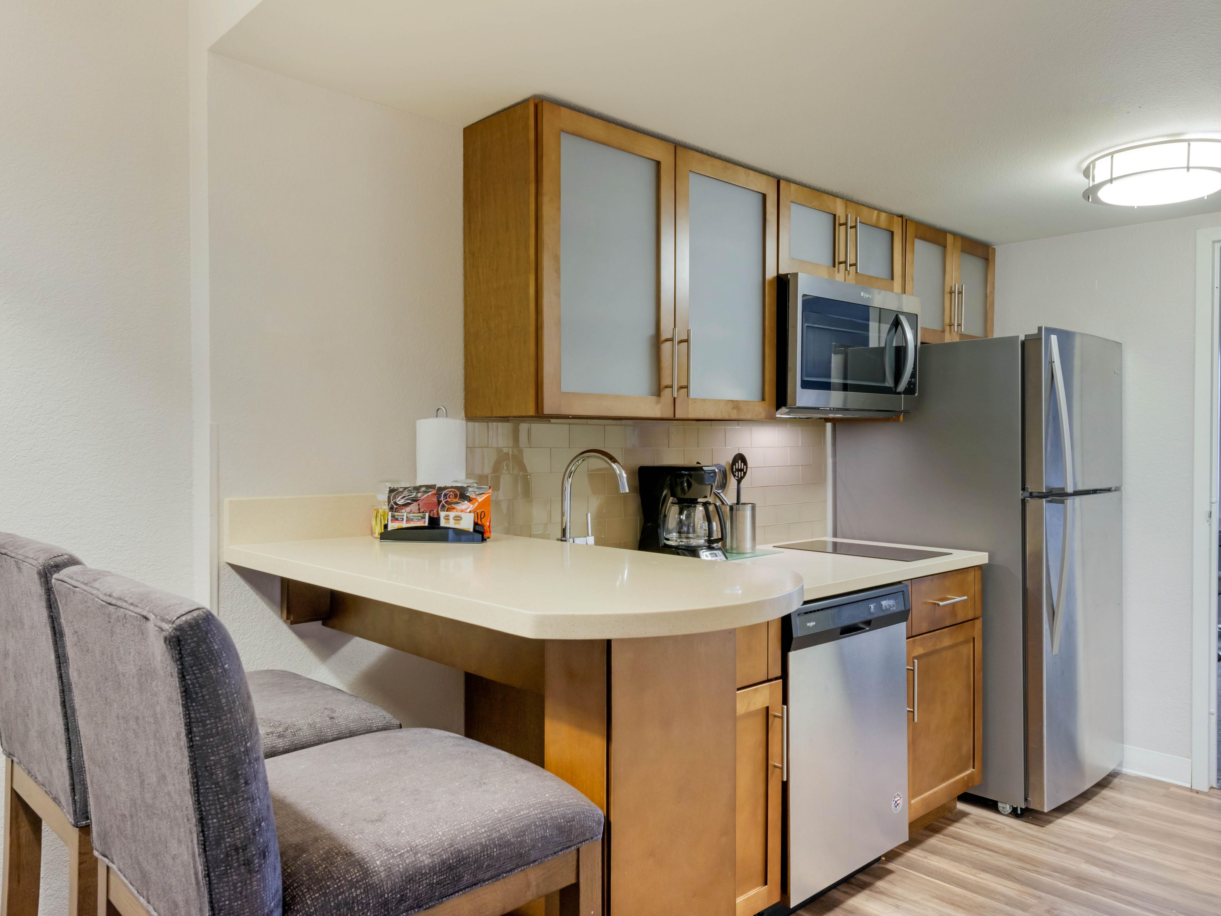 In-room kitchen area with microwave and refrigerator