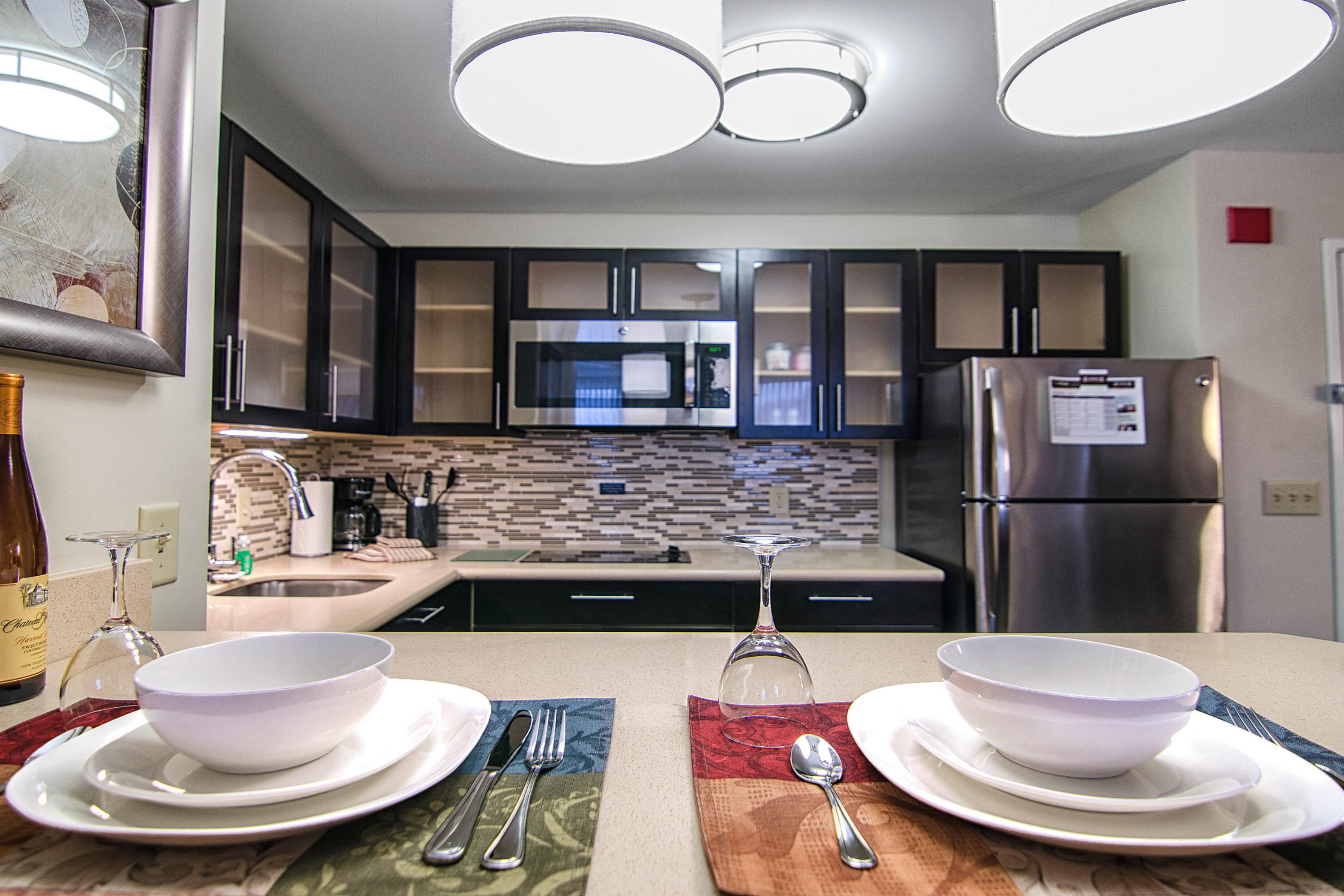 Whether here for a short visit or an extended stay, our guests enjoy the comforts of home with a fully equipped kitchen in every room. Each kitchen includes a cooktop, dishwasher, microwave, toaster, cookware, sink, a full-size refrigerator with an ice maker, and all the utensils and dishes you'll need.