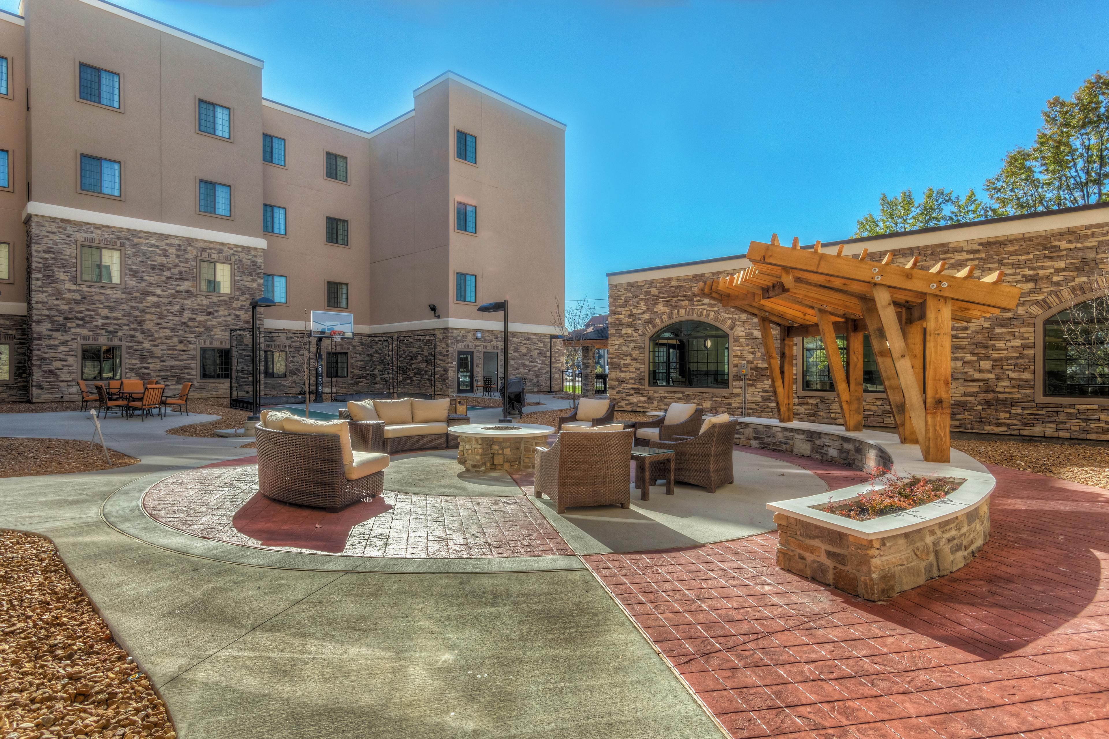 Take a break in our courtyard area, open to all guests. Offerings in this area include our basketball court, fire pit, and a guest accessible grill! 