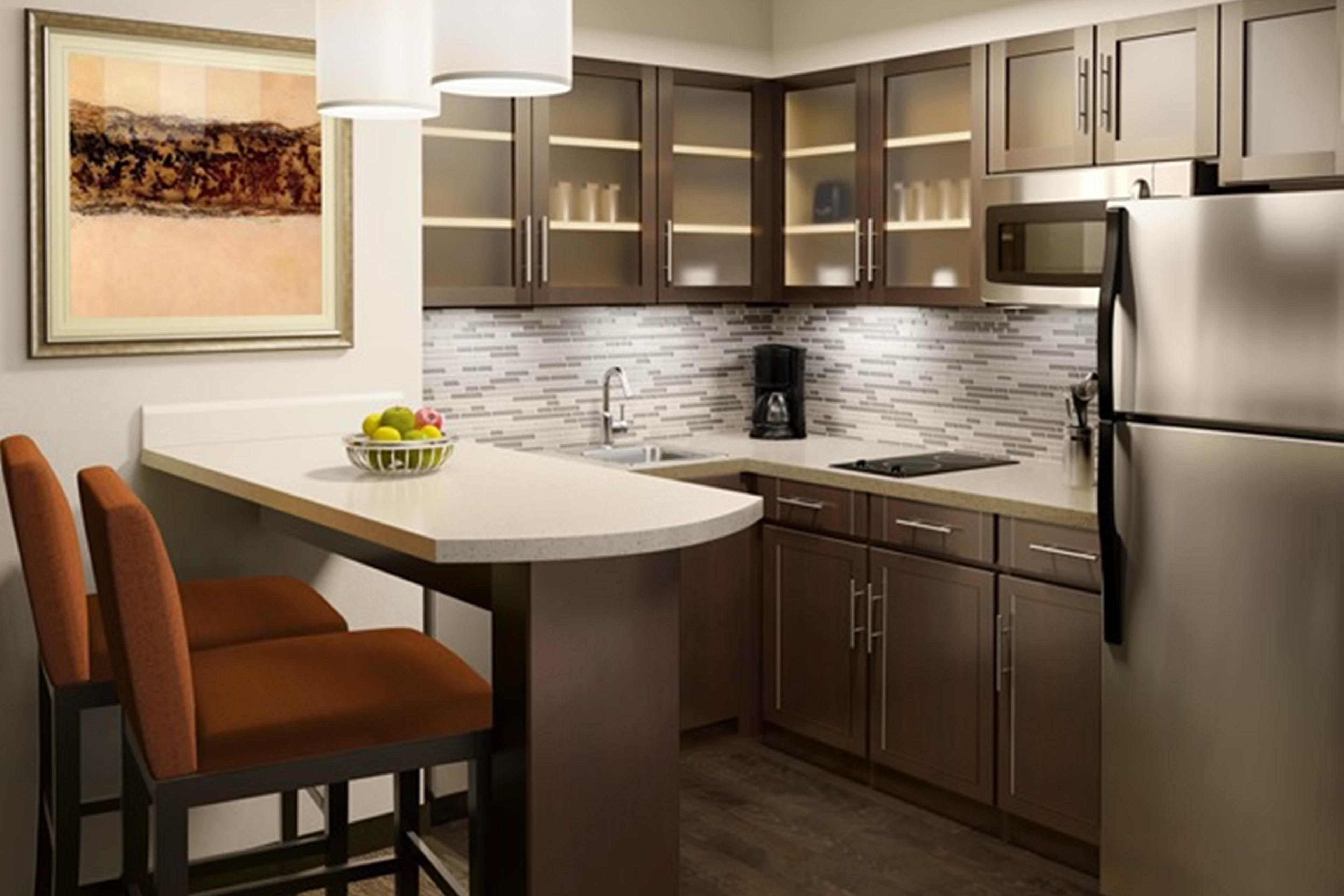 Our all-suite hotel comes with extra square footage and a fully equipped kitchen in every room.  Kitchens include a stove top, full size fridge, microwave, dishwasher, sink with garbage disposal, cookware, dinnerware and serve ware. 