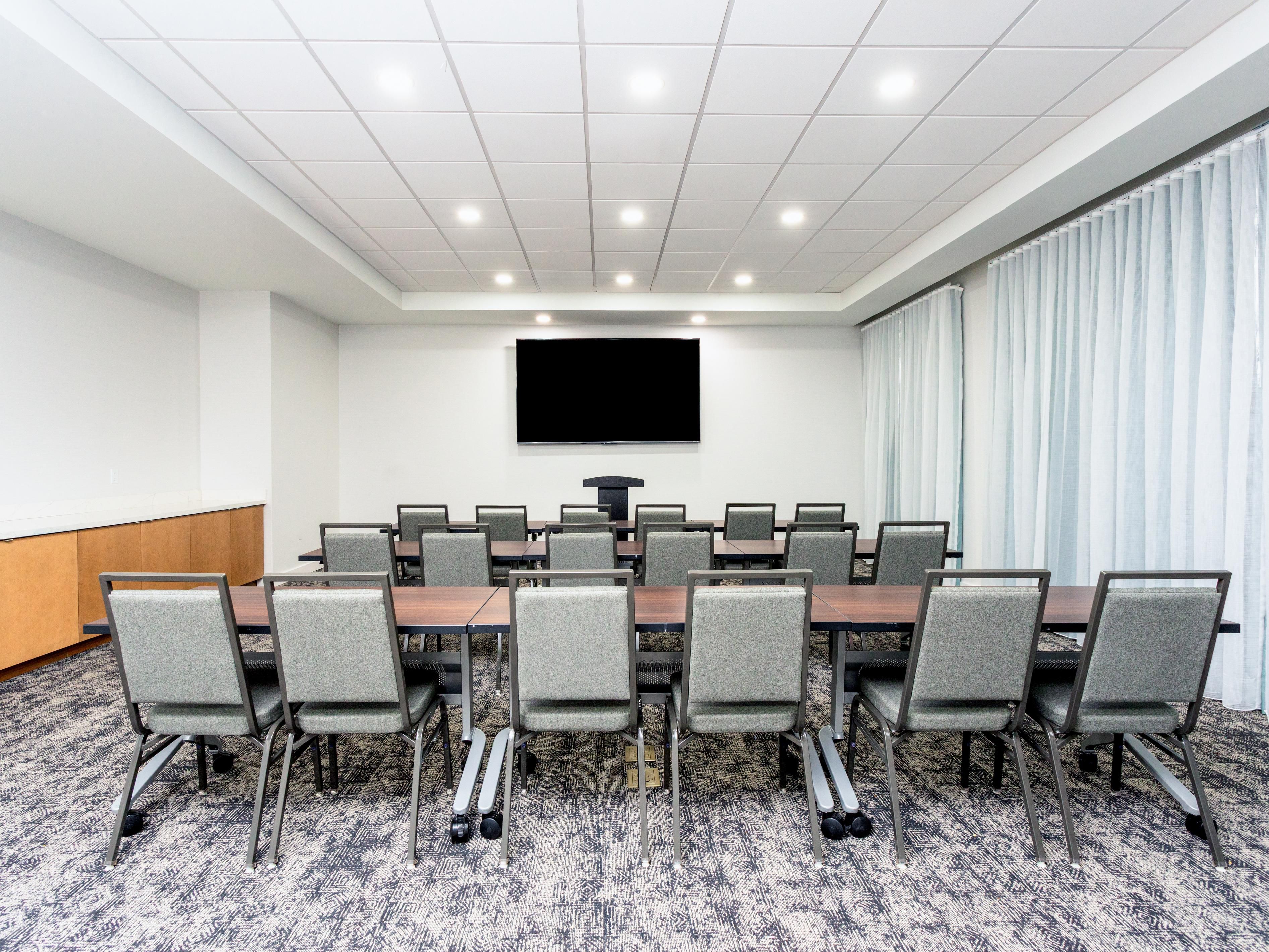 Classroom style meeting room with television